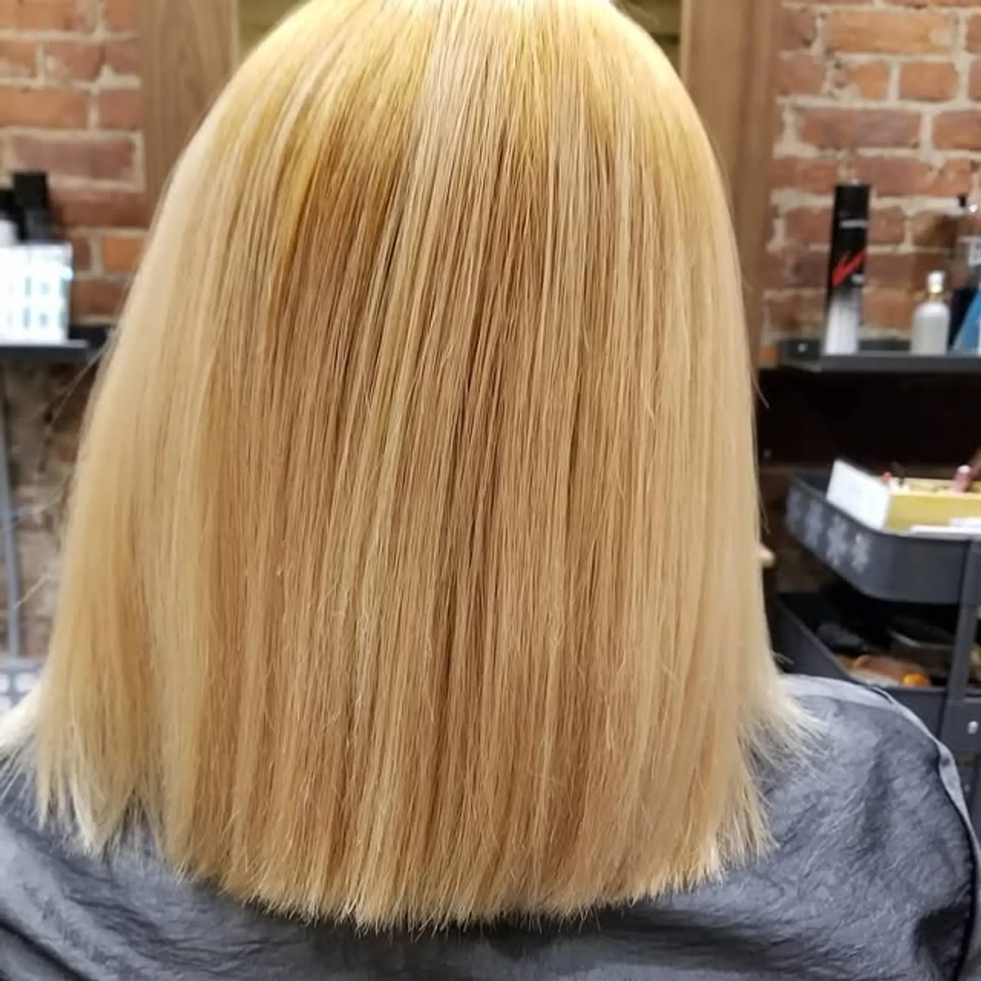 A sleek, medium-length blunt bob. 1
