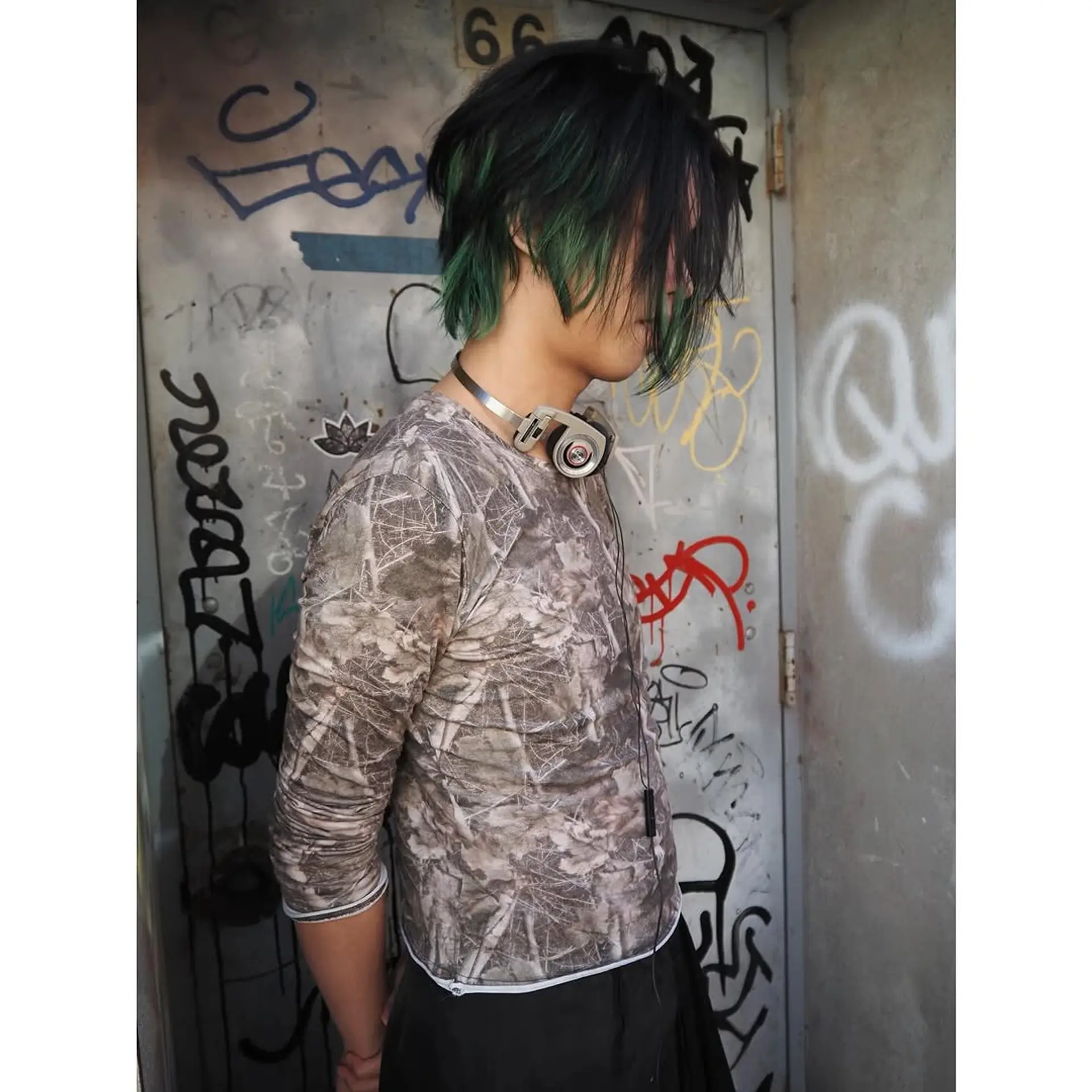 Short, layered and textured emo hairstyle with vibrant colored tips. 1
