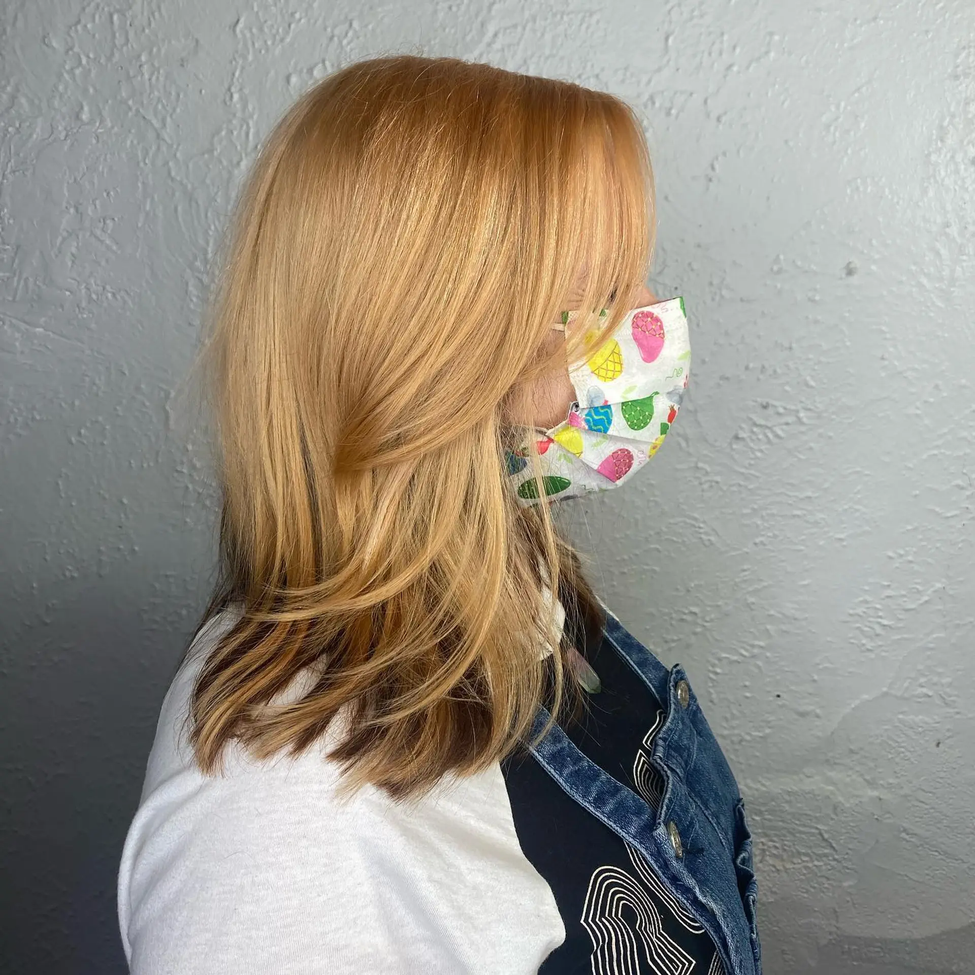 A shoulder-length lob with soft layers and a golden blonde color. 2