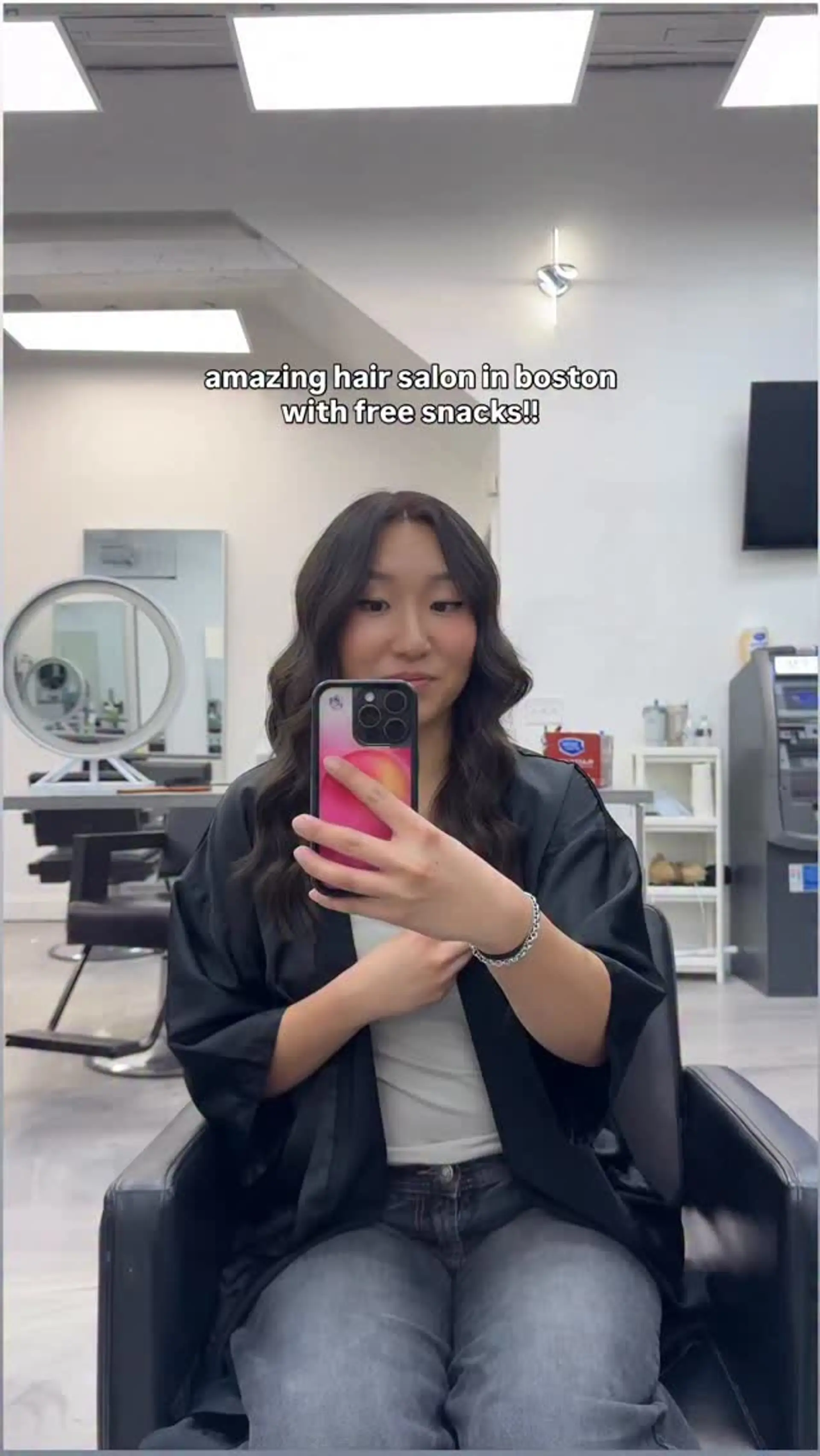 Medium-length cool brown hair styled with soft, voluminous waves and a center part. 1