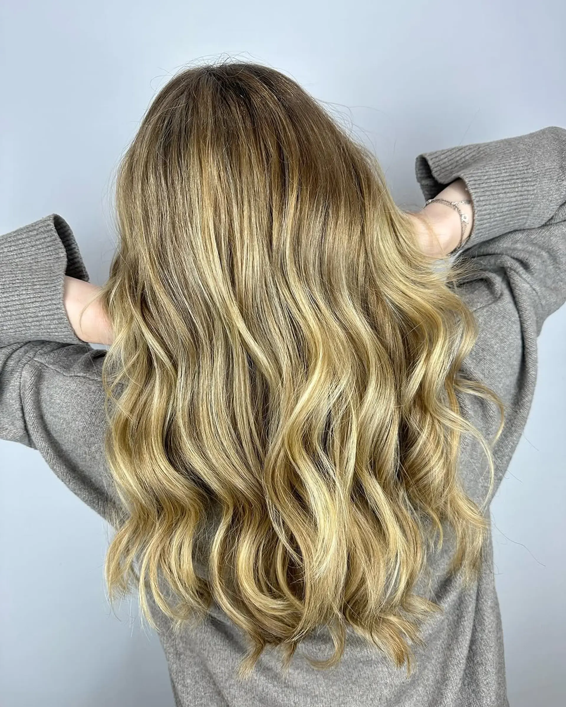 A dimensional ash blonde balayage with soft, natural-looking highlights. 1