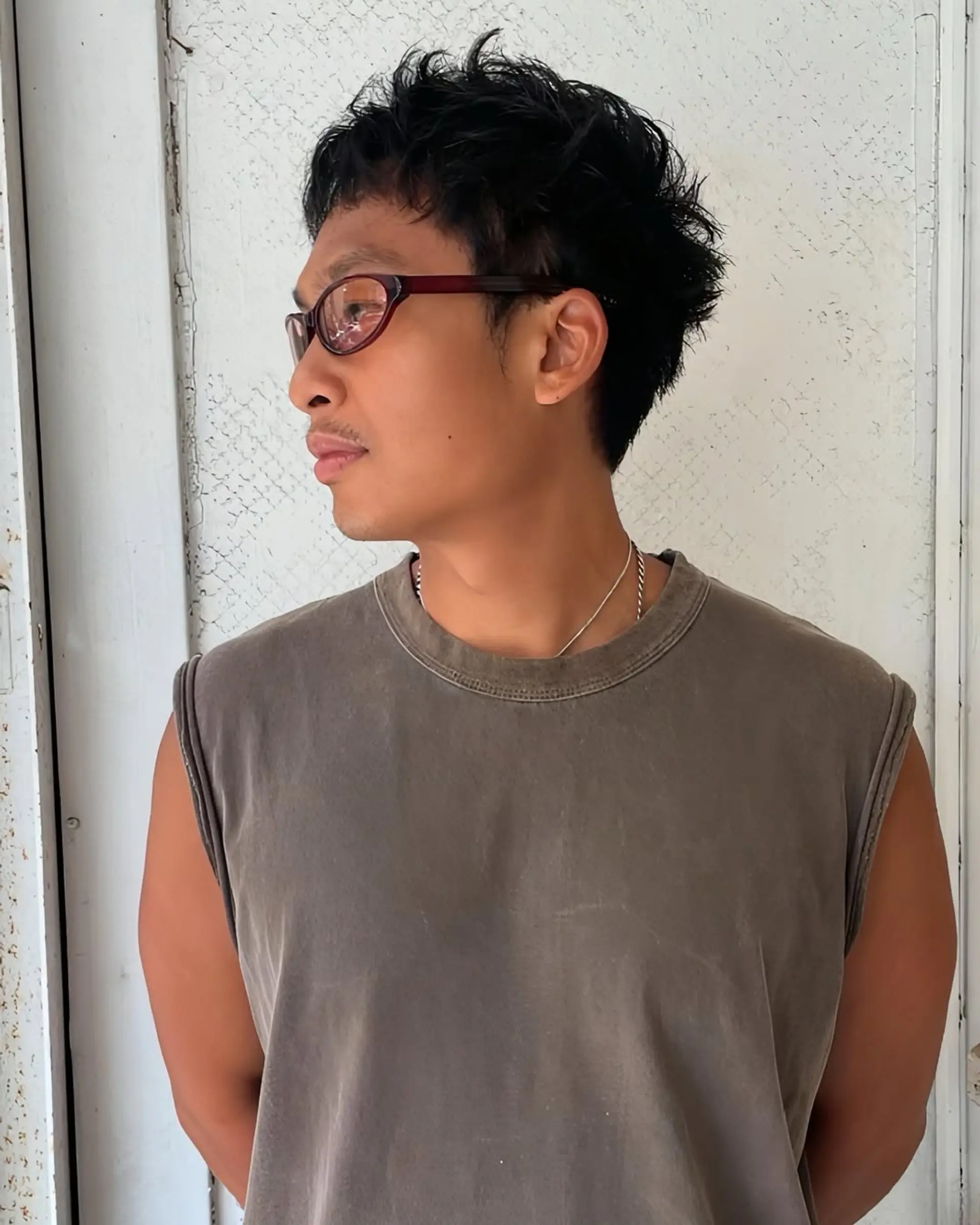 A short, textured cut with natural waves and a casual, tousled finish. Features a chic, spiky fringe with a low-maintenance appeal. 1