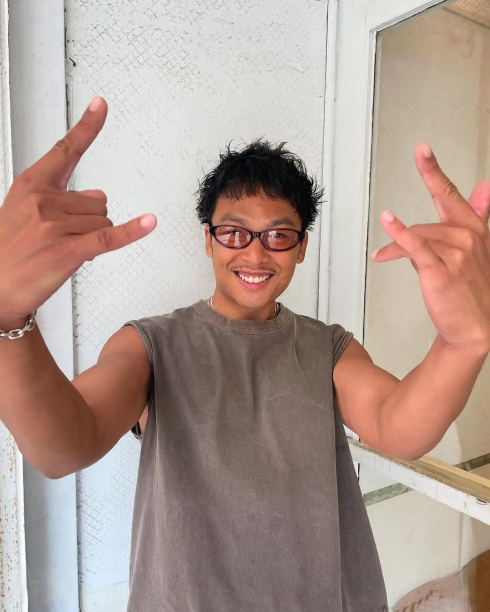 A short, textured cut with natural waves and a casual, tousled finish. Features a chic, spiky fringe with a low-maintenance appeal. 2