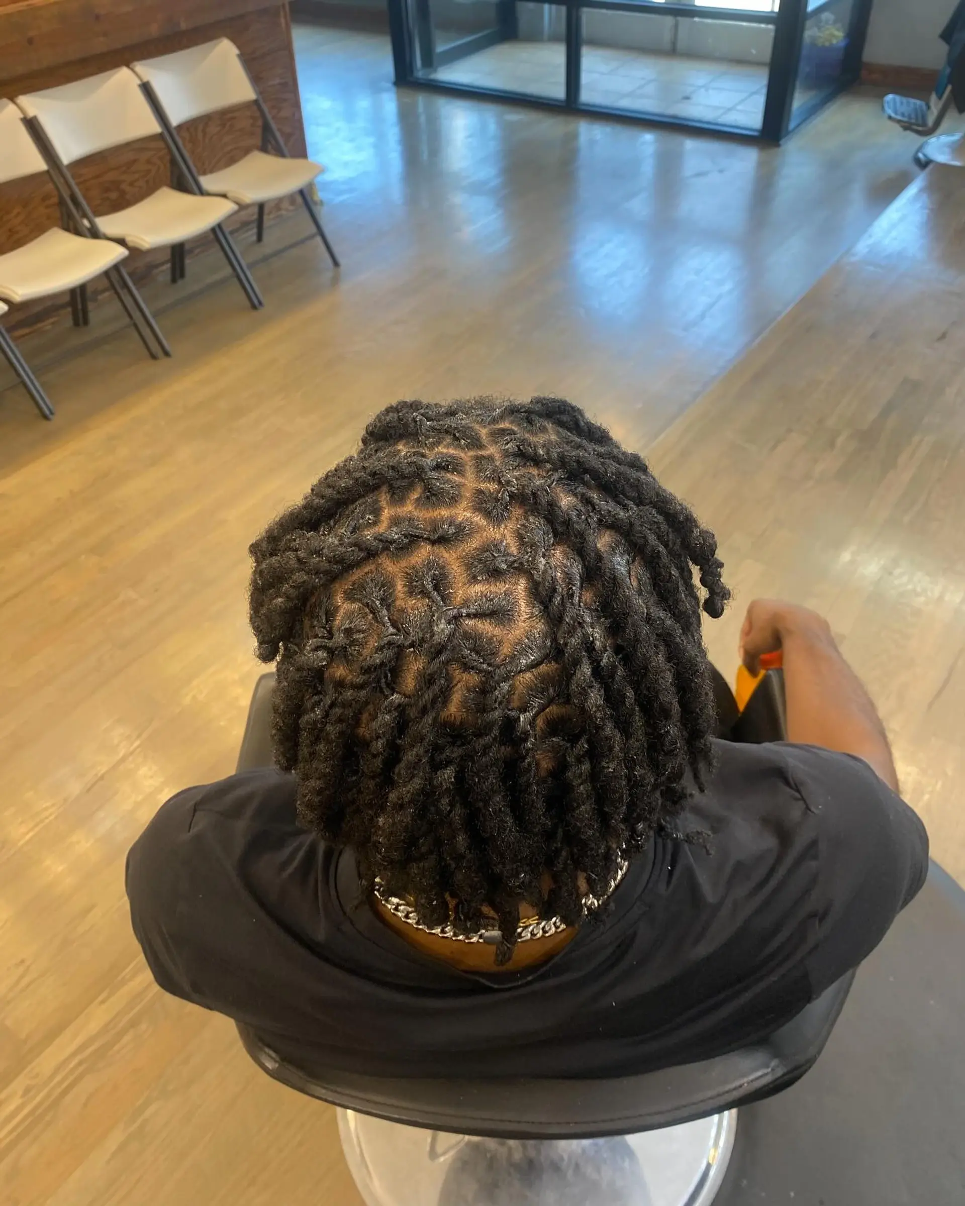 Short starter locs, a popular and low-maintenance hairstyle for coiled hair. 1