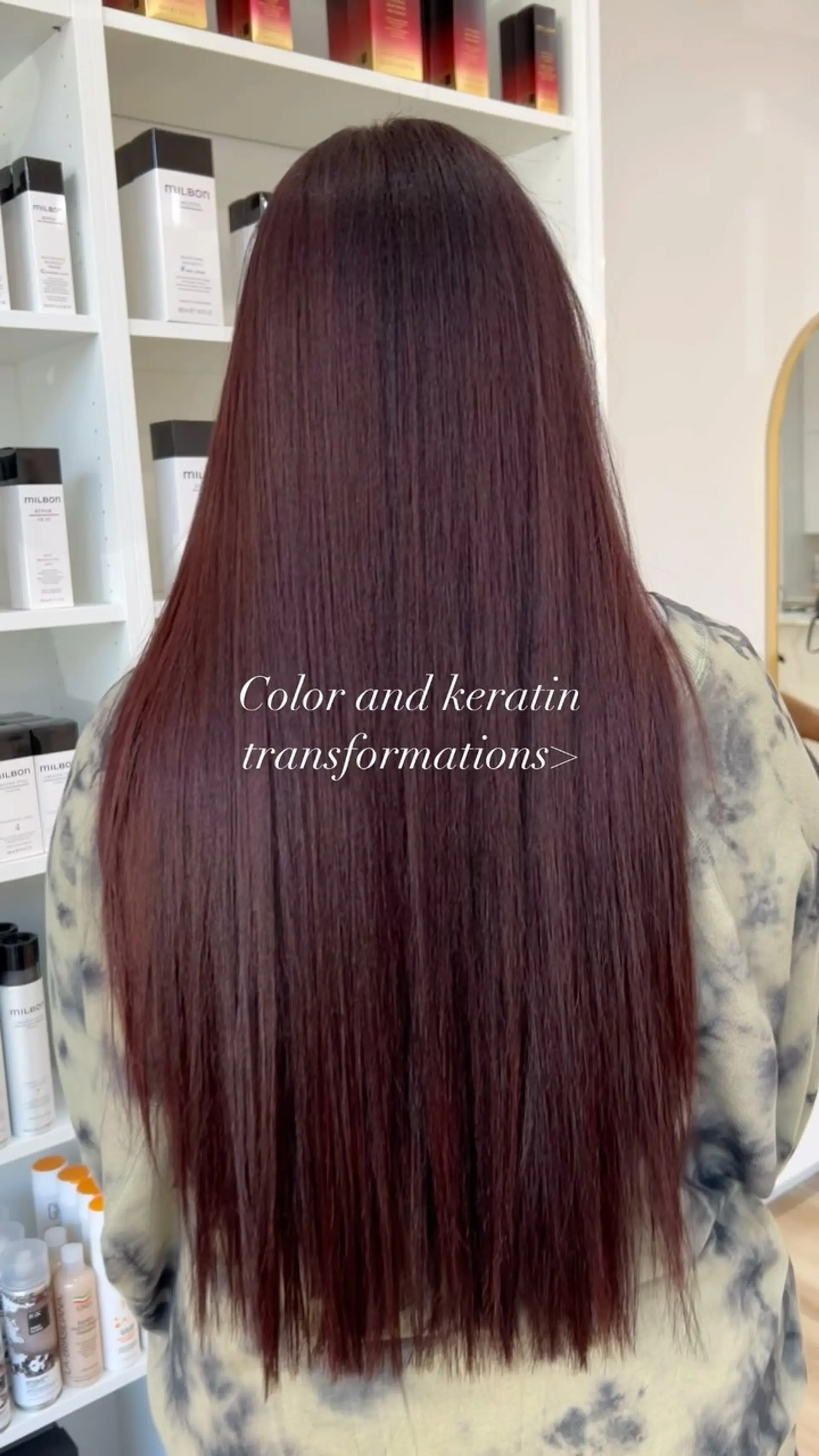 Extra-long, smooth and straight hair colored in a rich red-violet burgundy tone with soft textured ends. 1