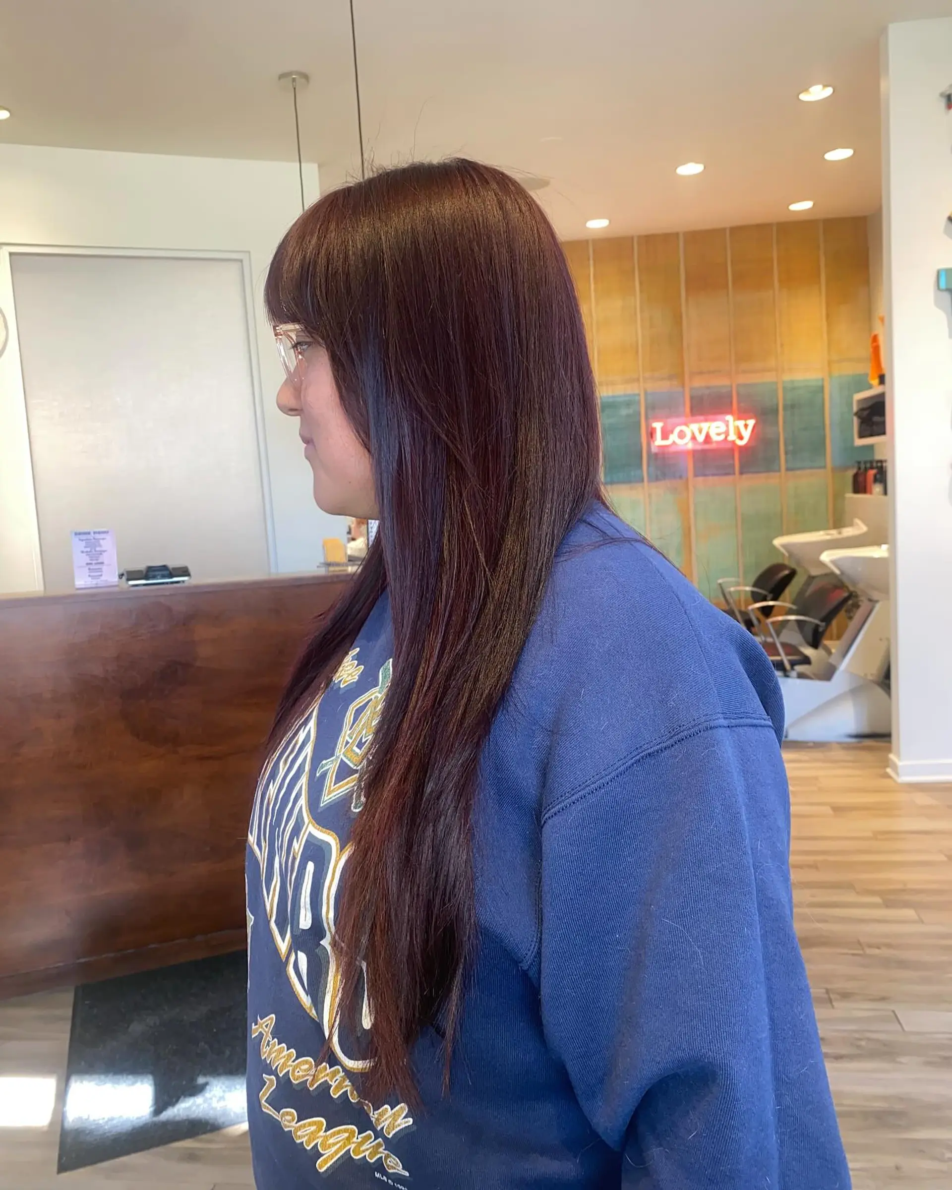 A long, layered haircut with face-framing bangs. 1