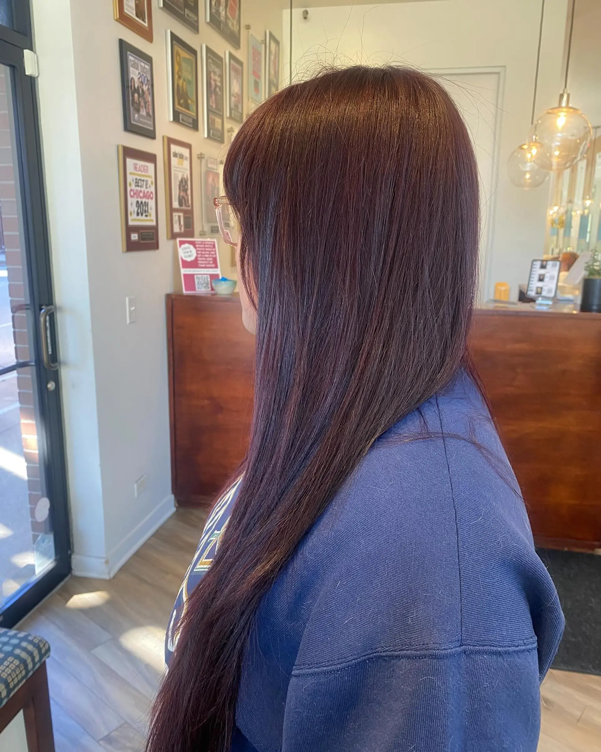 A long, layered haircut with face-framing bangs. 2