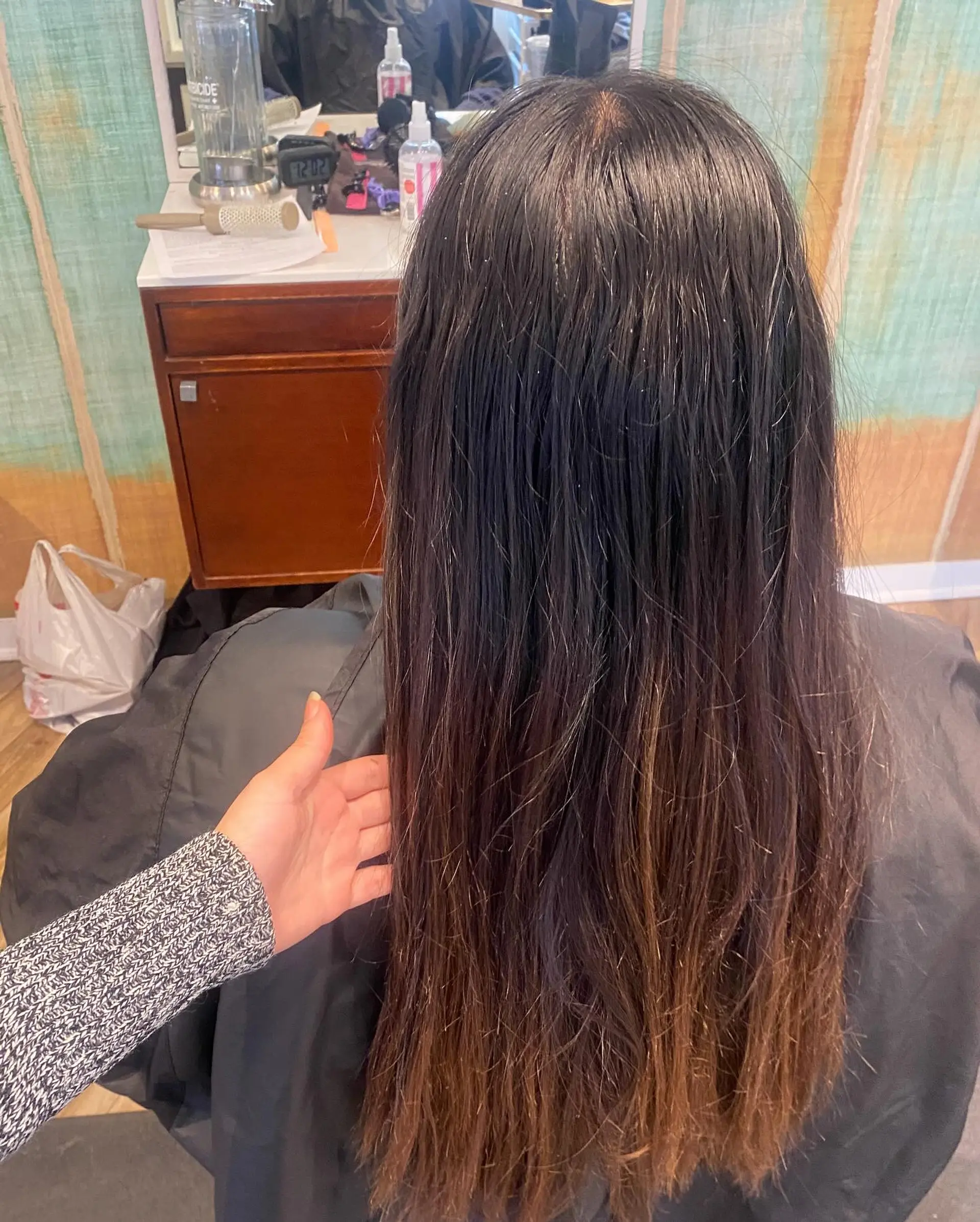 A long, layered haircut with face-framing bangs. 3