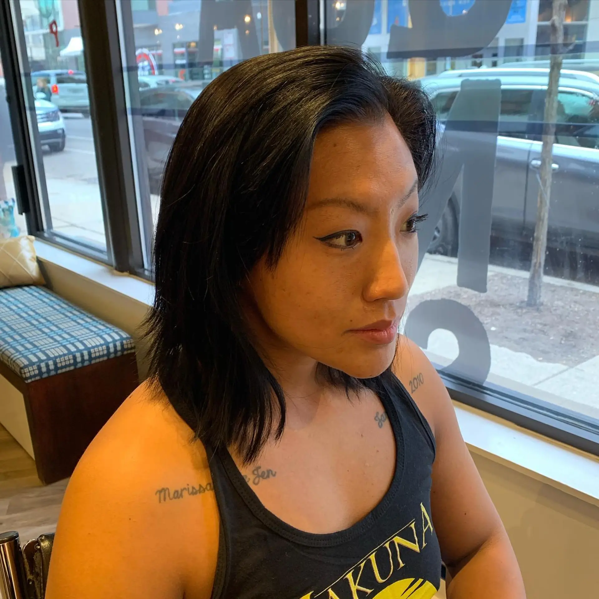 A short, modern pixie cut with an undercut. The top is textured, and the sides and back are closely shaved. 2