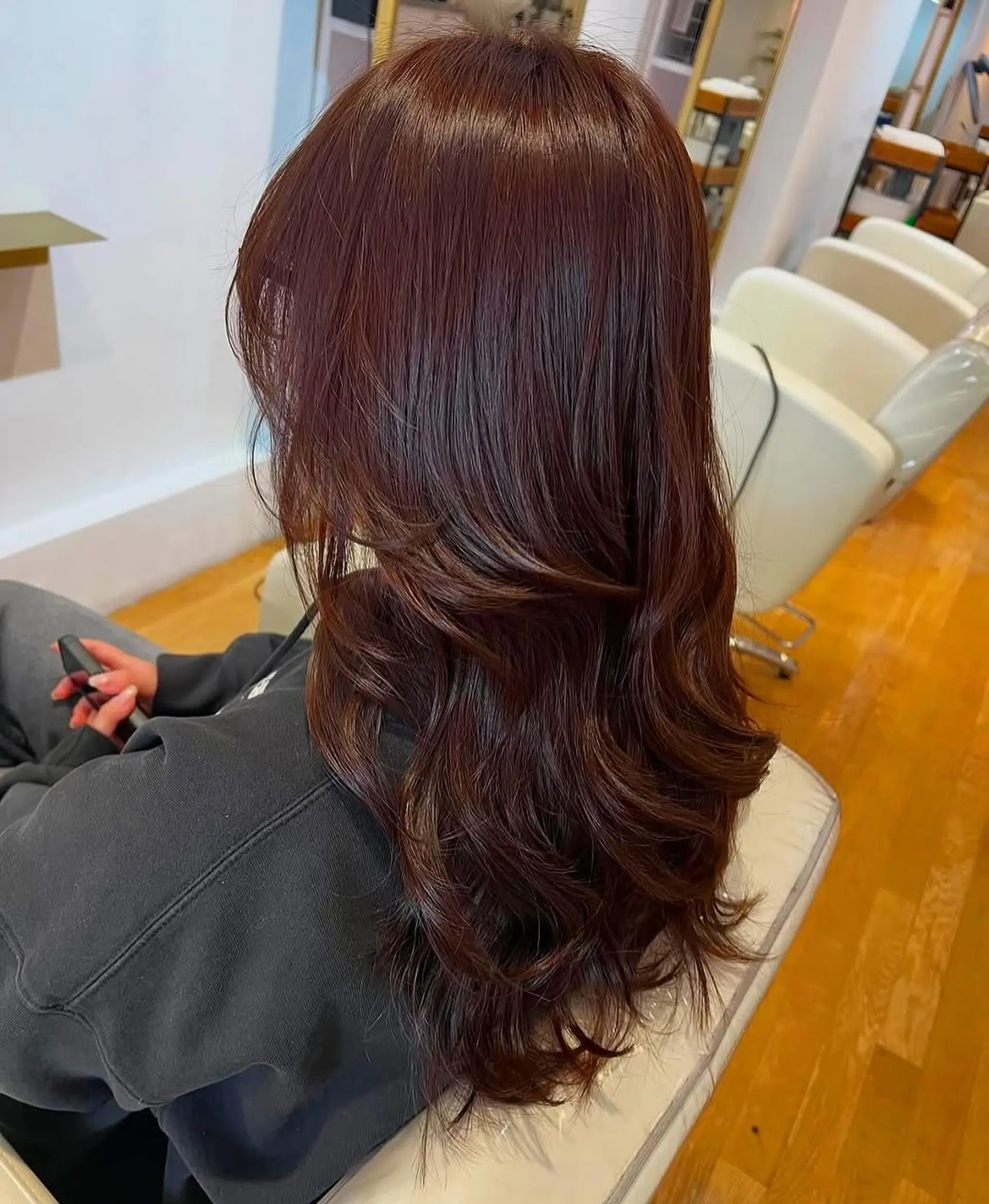 Long, wavy hair with face-framing layers. 1