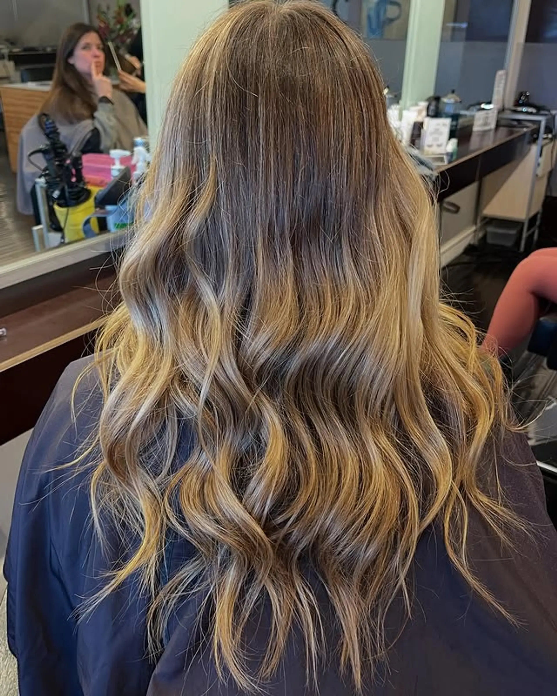 Long wavy hair with a beautiful honey blonde balayage. 1