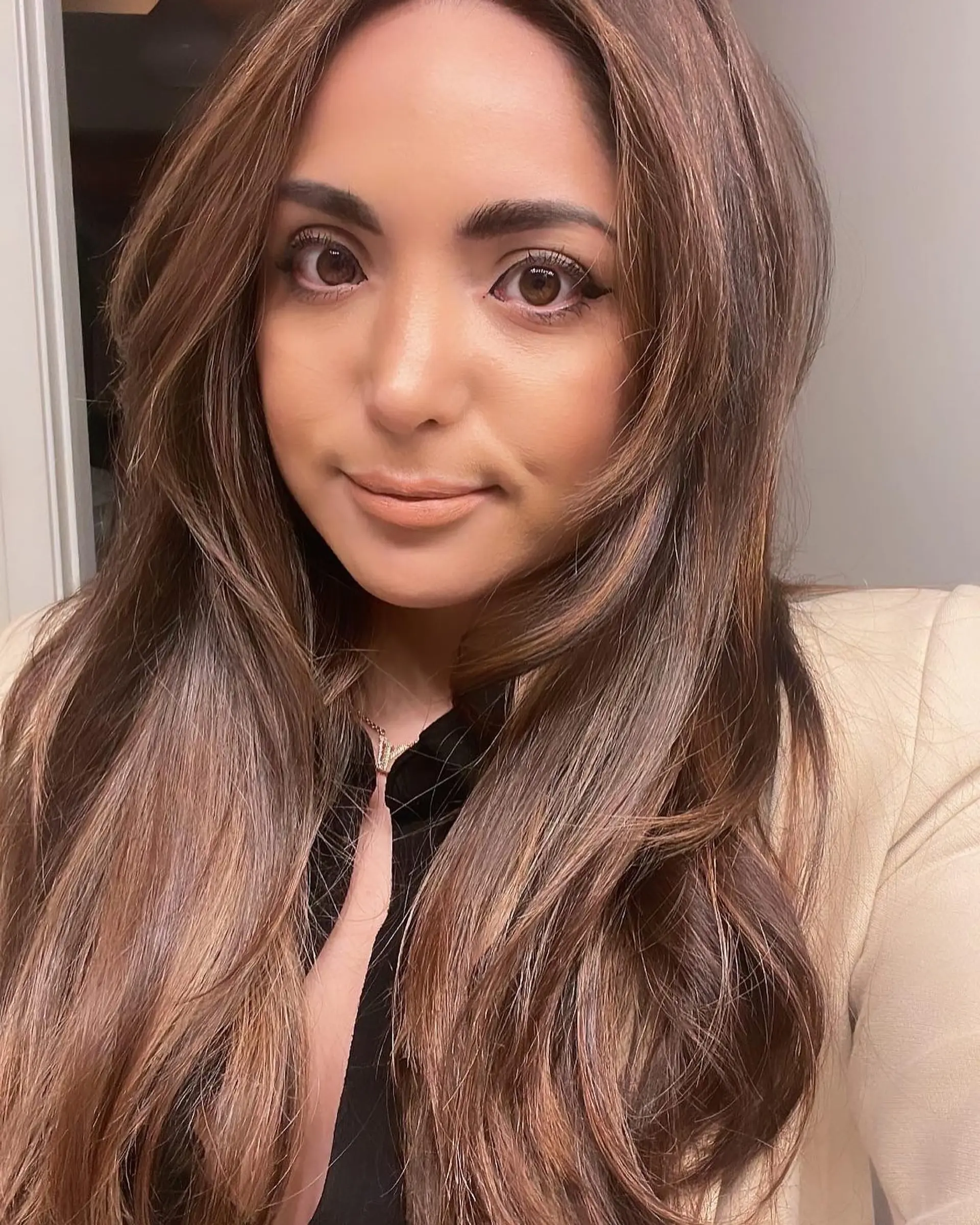 Long, layered brunette hair with face-framing highlights. 1