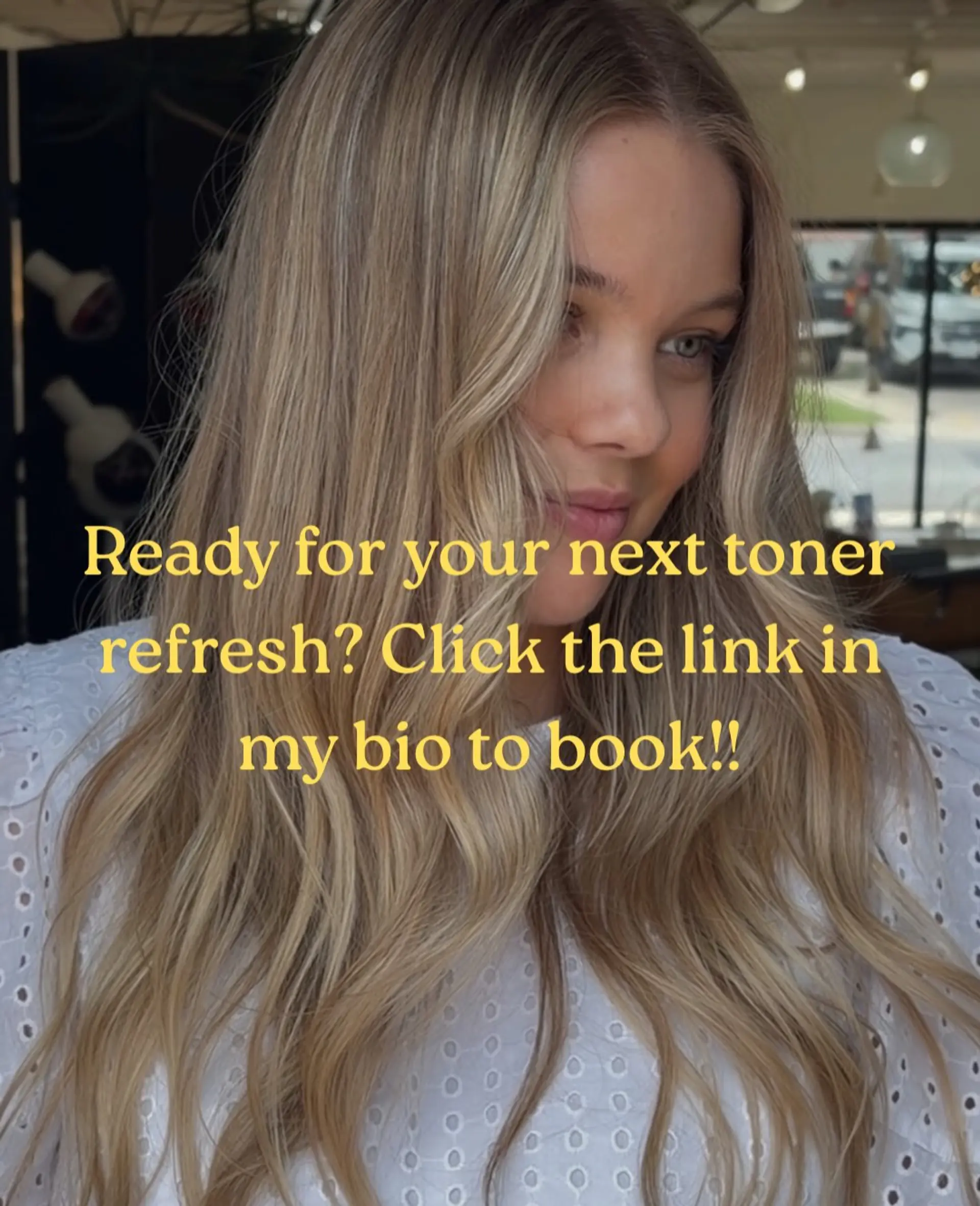 Long beige blonde hair styled with soft, loose waves and face-framing layers. 1