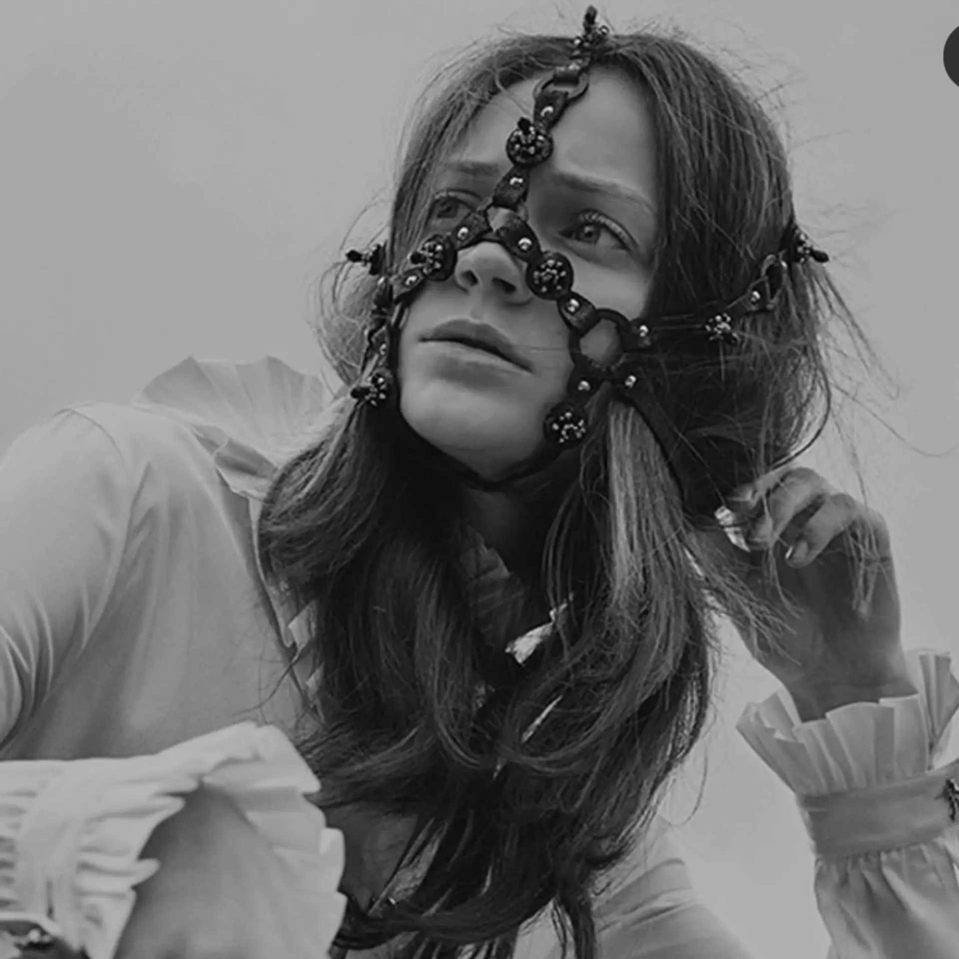 Long, textured wavy hair with face-framing highlights styled for an editorial portrait. 1