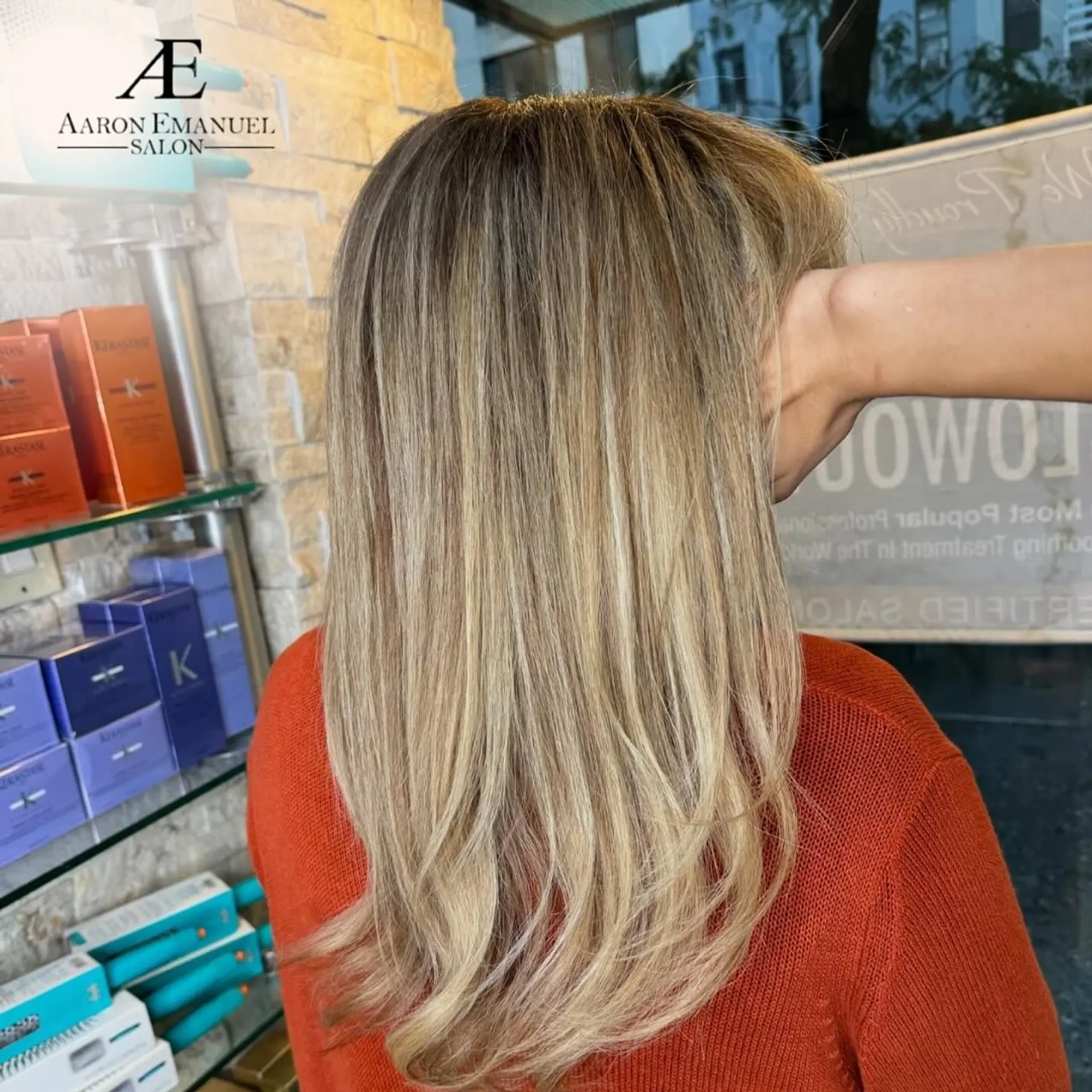 This medium-length hairstyle features a bronde balayage and subtle layers. 1