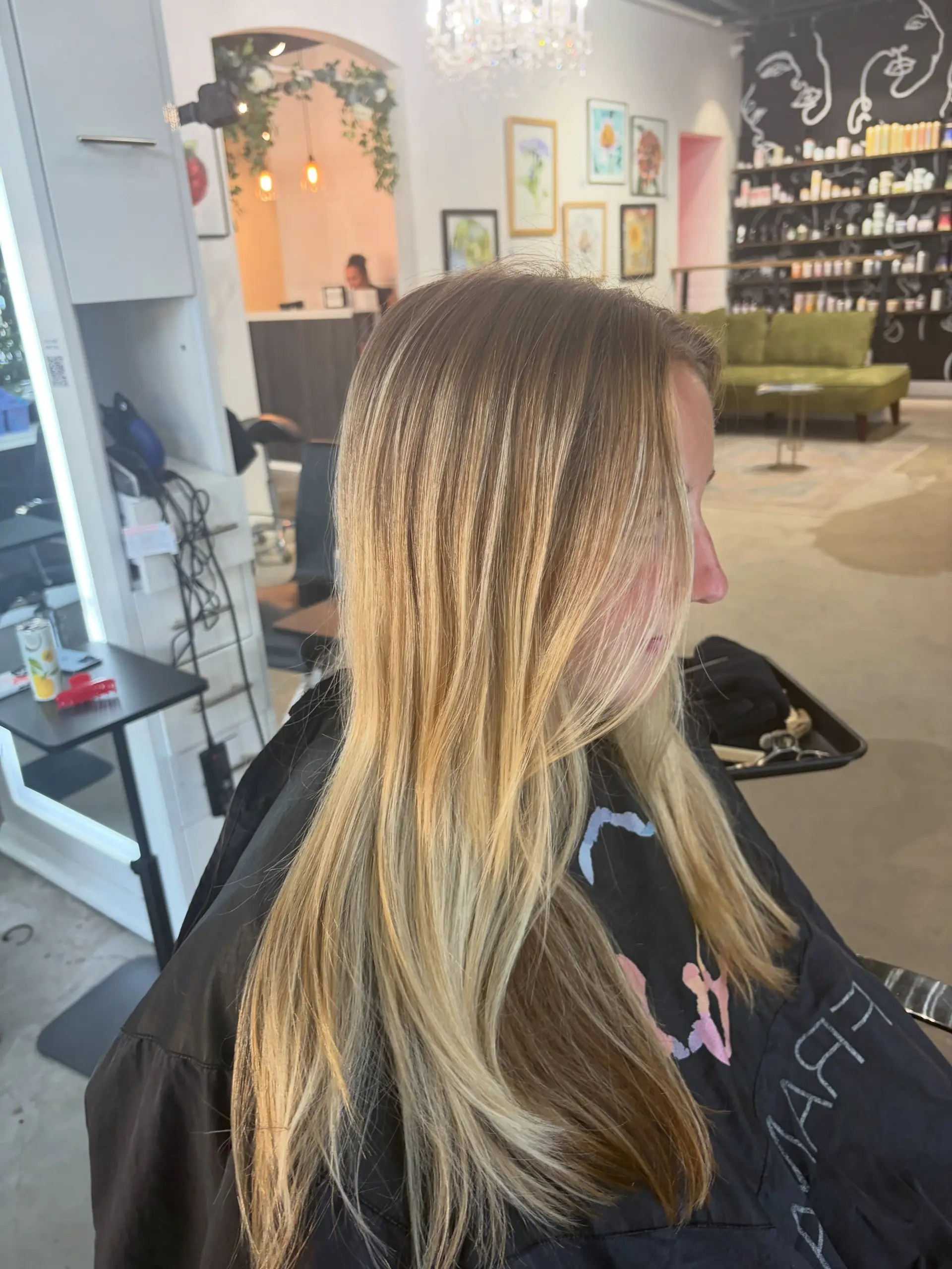 Long, straight layered hair featuring dimensional lived-in blonde highlights blended with natural light brown undertones. 1