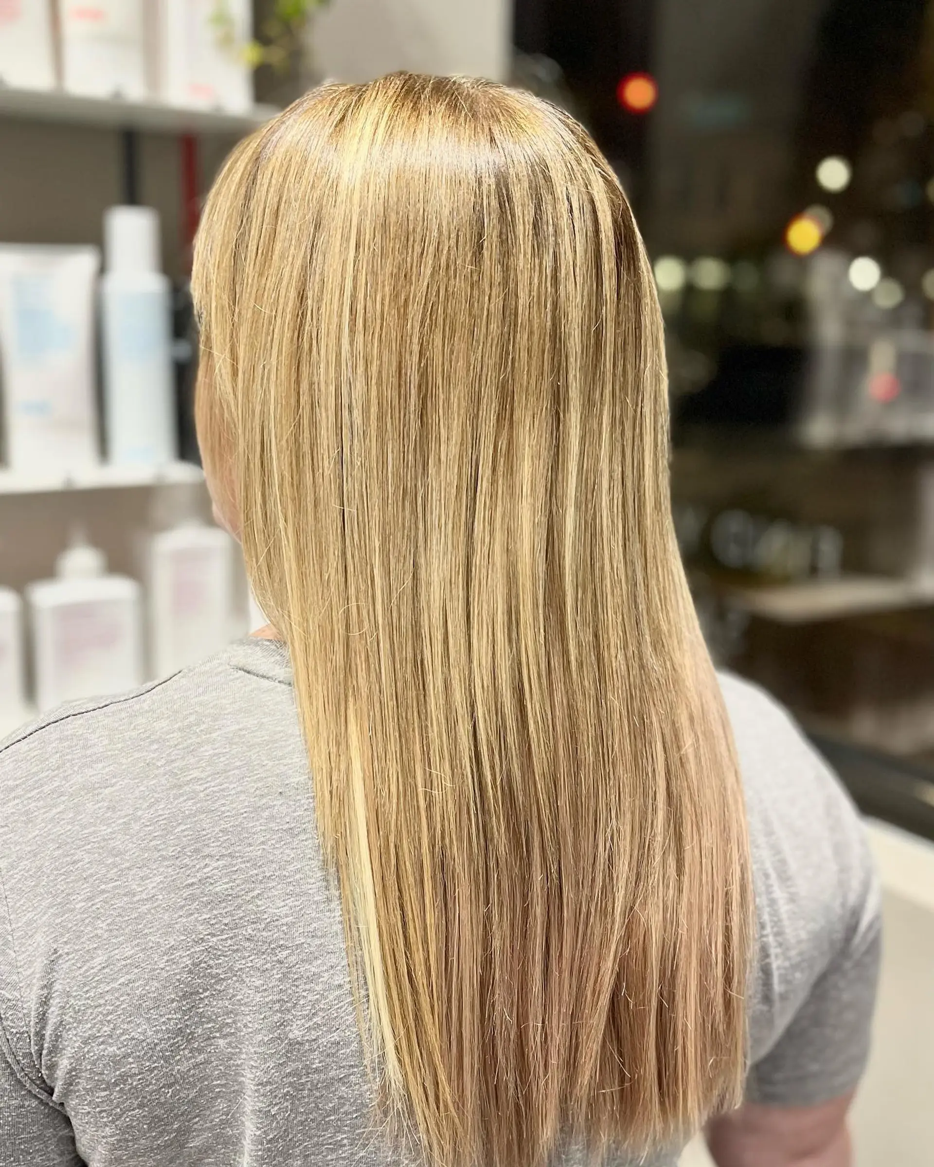 Long, straight hair with golden blonde highlights and subtle layering. 1