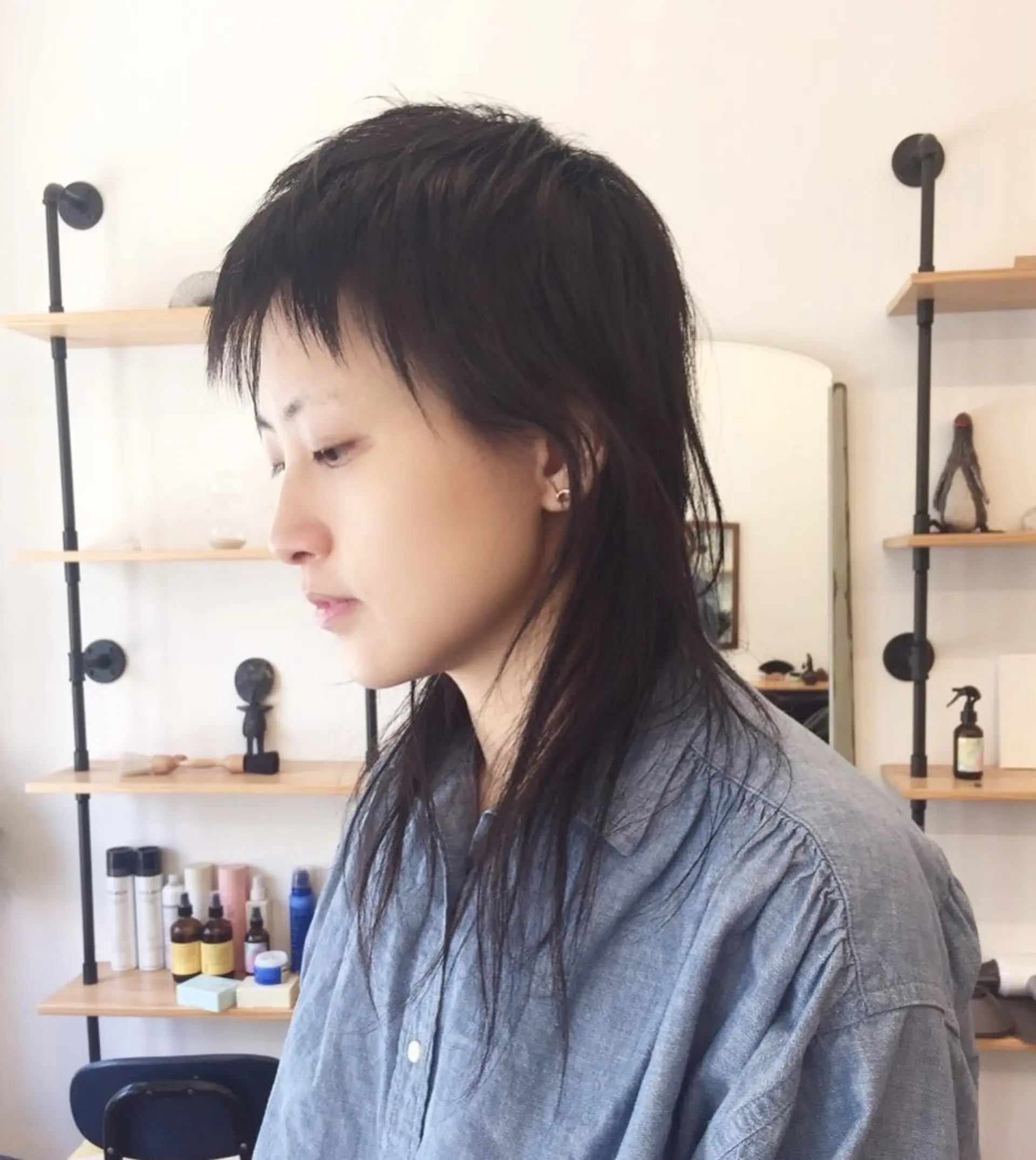 Edgy shag mullet with long, shaggy layers and a short fringe in an alternative, modern style. 1