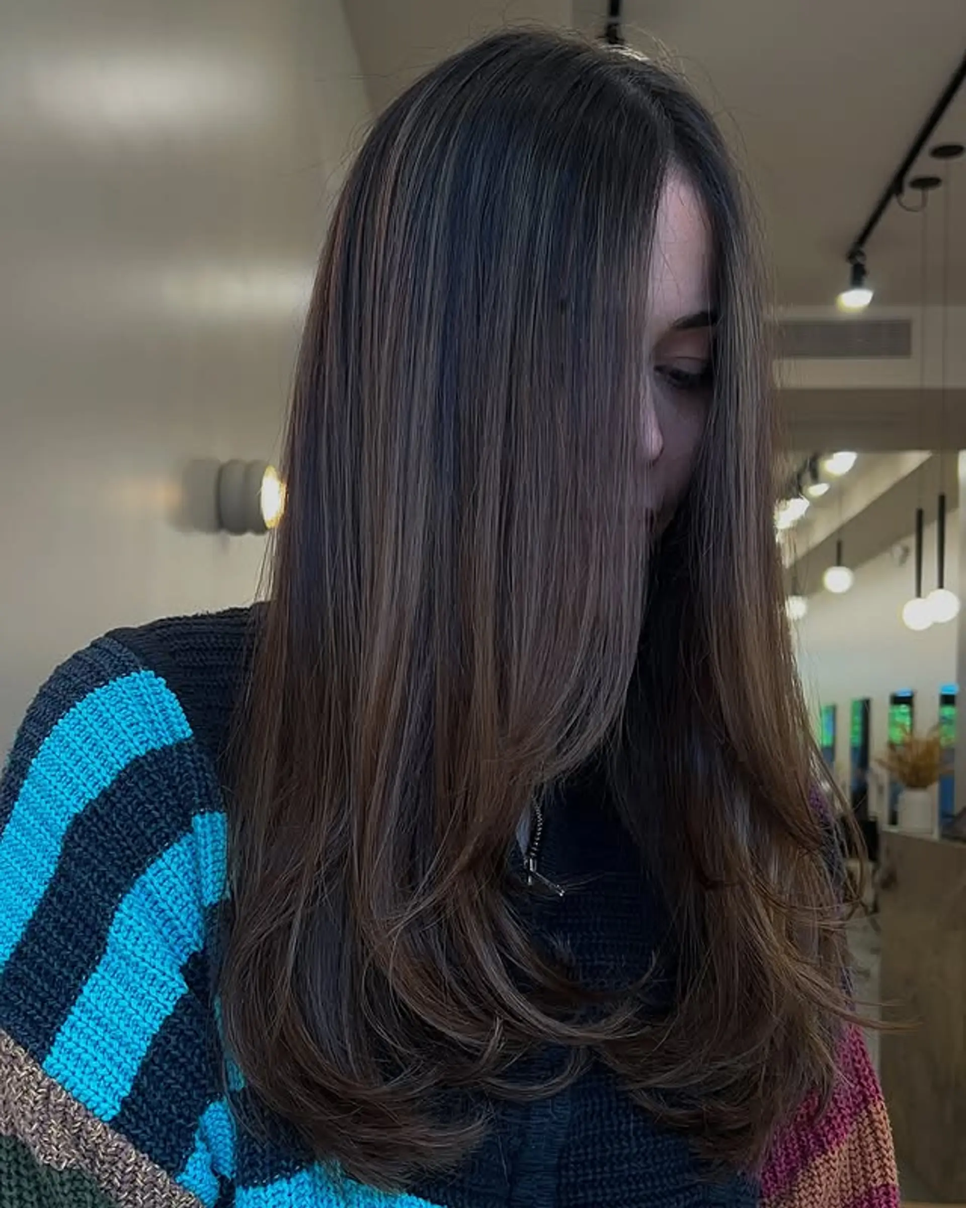 Long layered straight hair with a bronzed balayage. 1