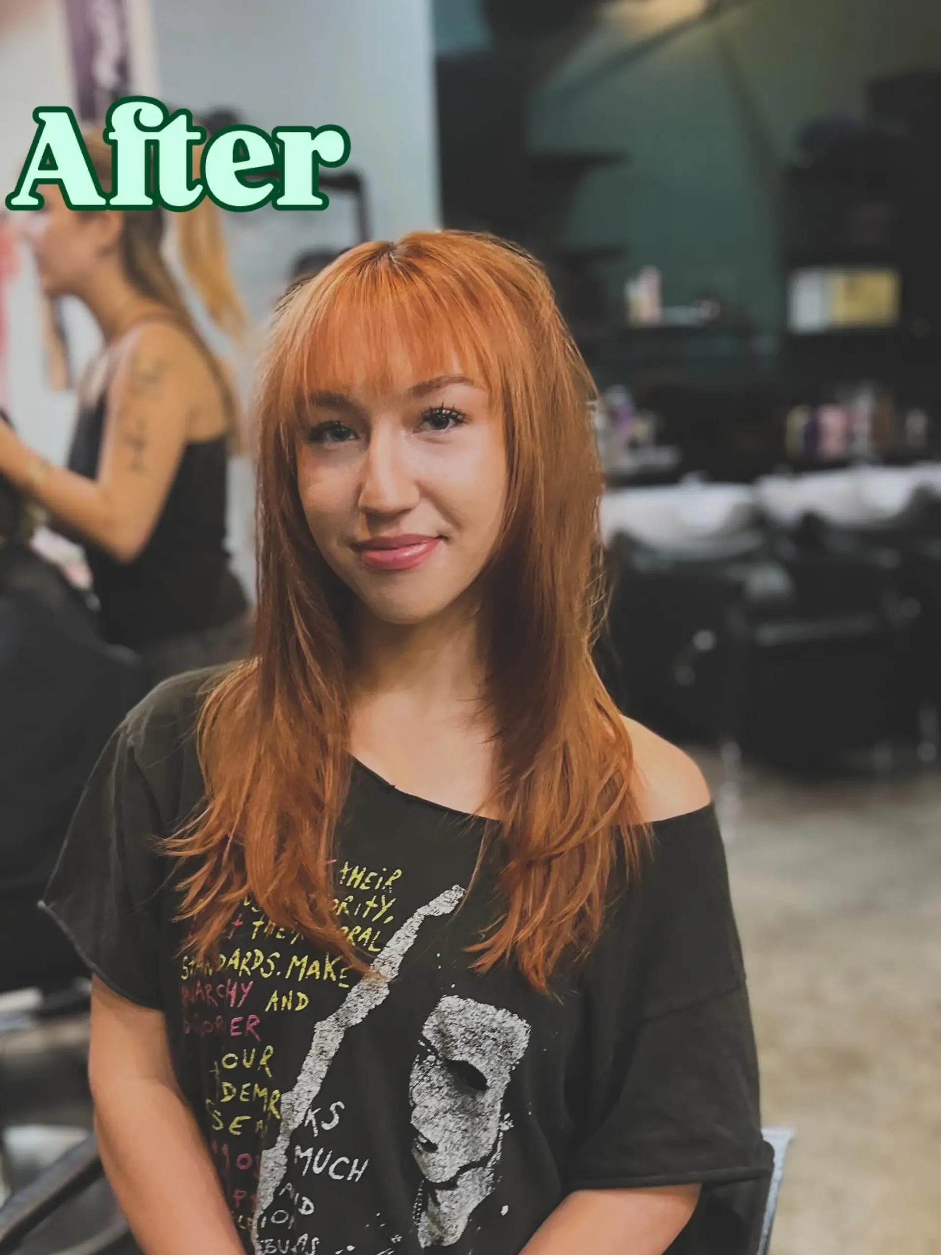 Long copper hair cut with feathered face-framing layers and soft, textured eyebrow-length bangs. 1