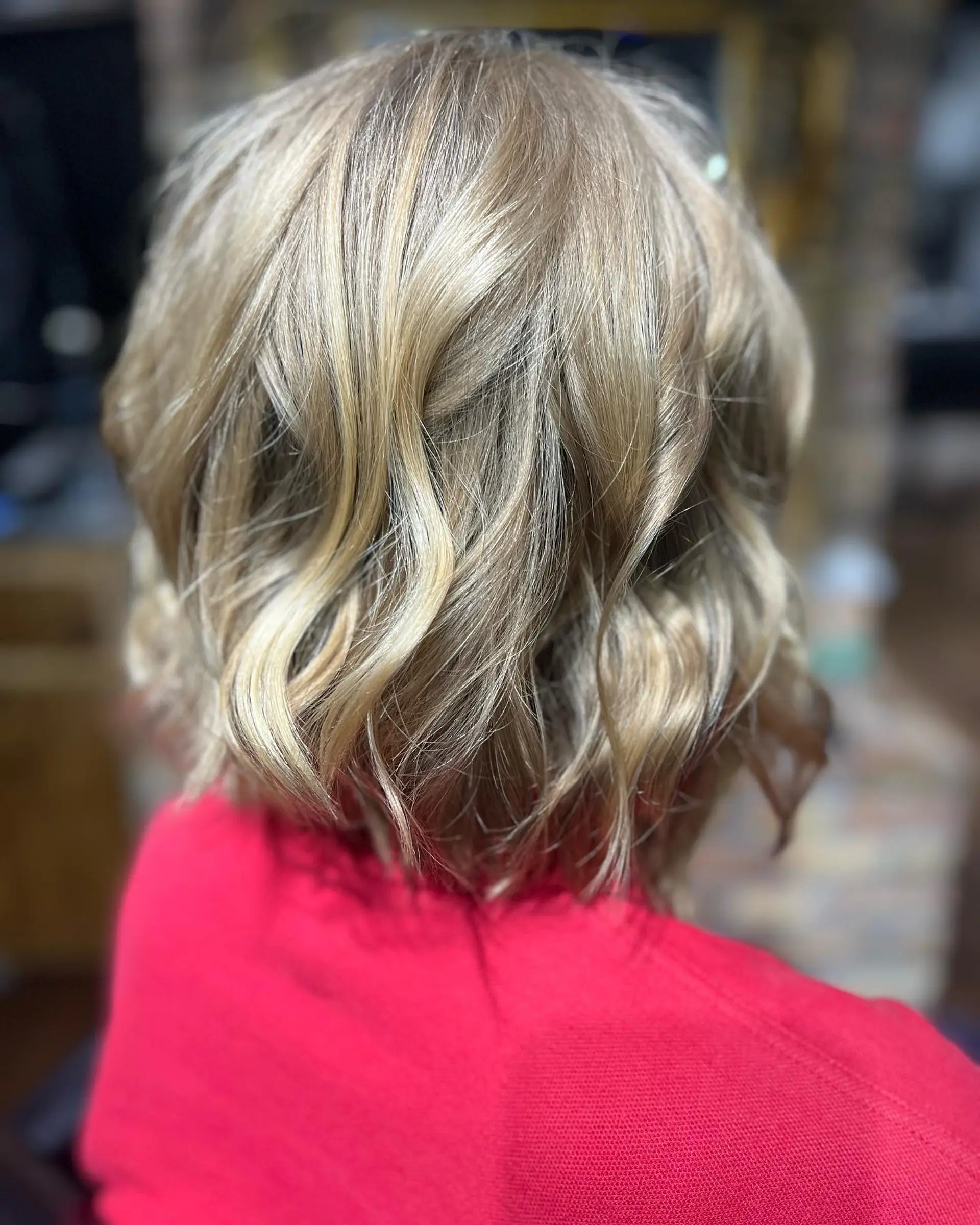 A medium-length wavy bob with soft beach waves and a textured finish. 1