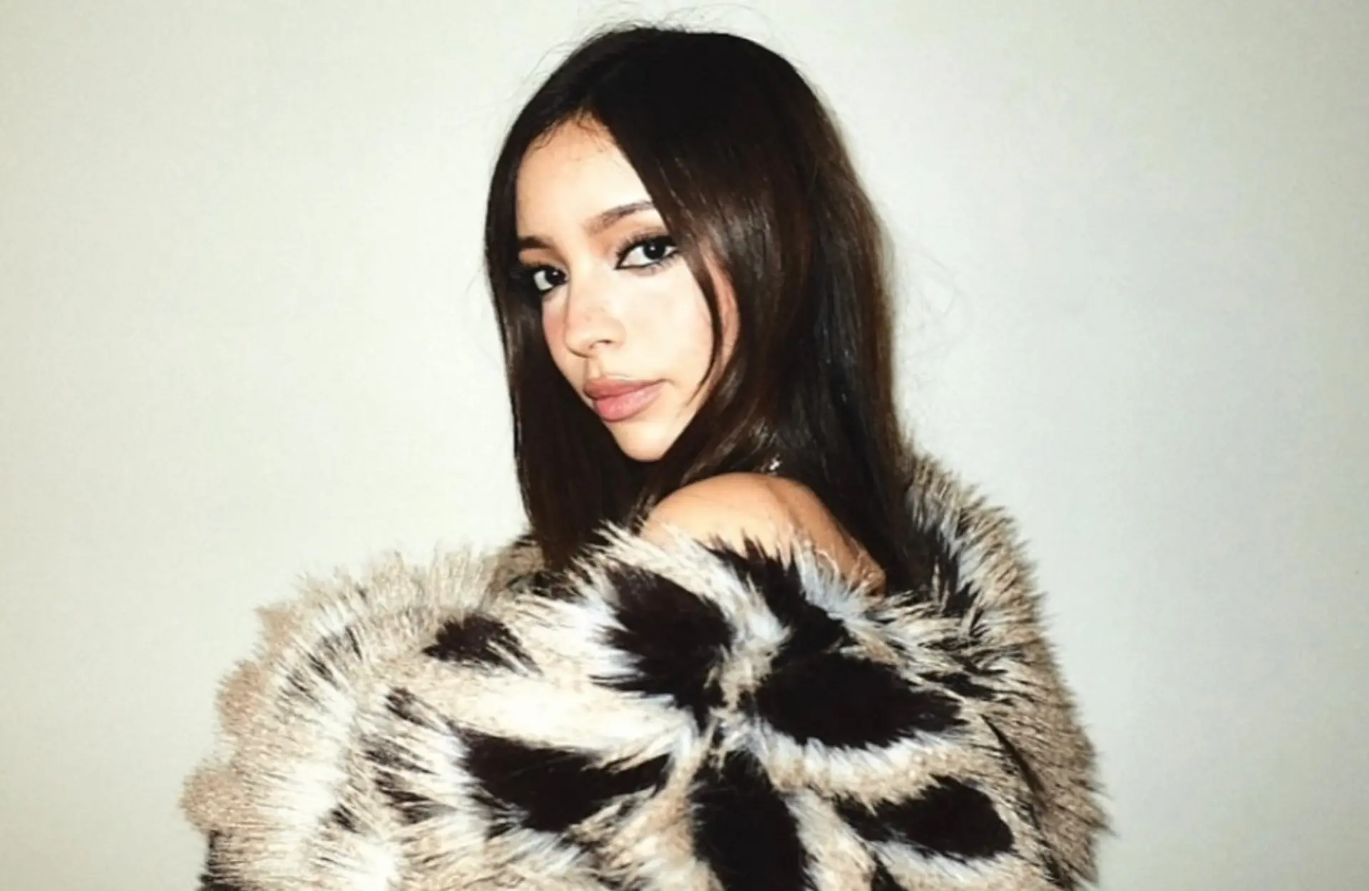 Long, sleek dark brown hair styled straight with a center part and soft face-framing strands. 1