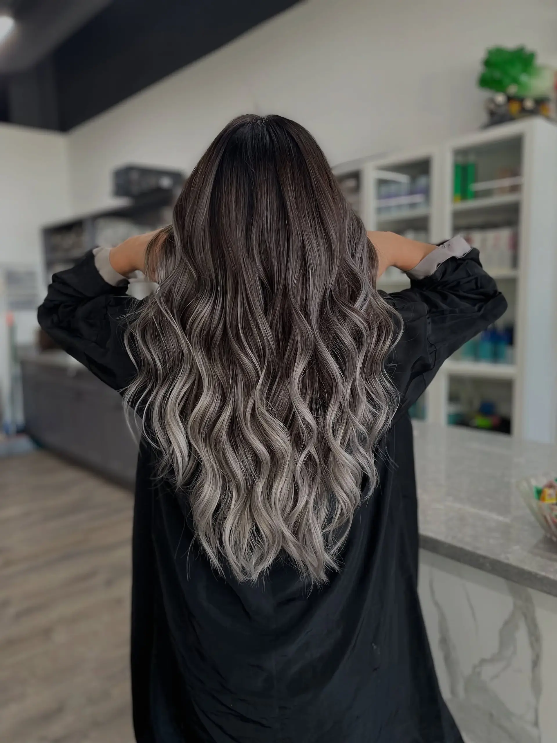 Long, wavy hair with an ombre color effect. 1