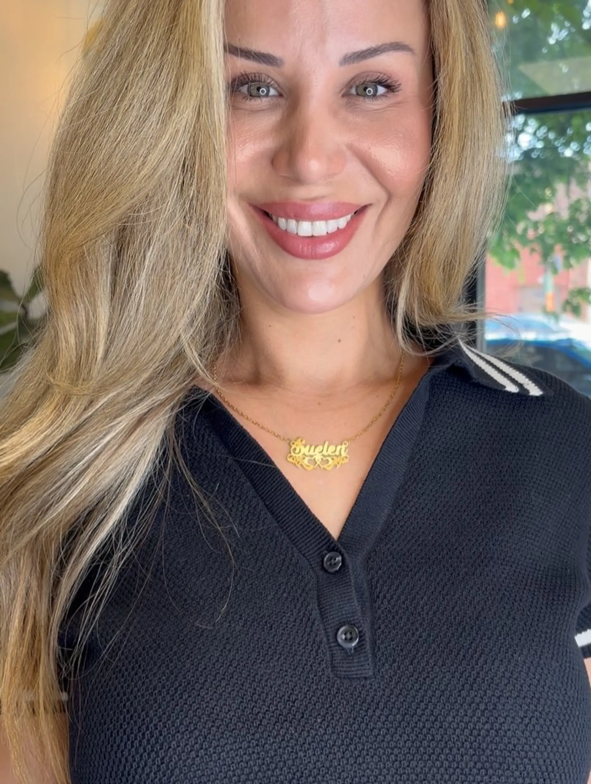 A sleek, smooth blowout featuring long golden blonde hair with subtle highlights parted slightly to the side. 1