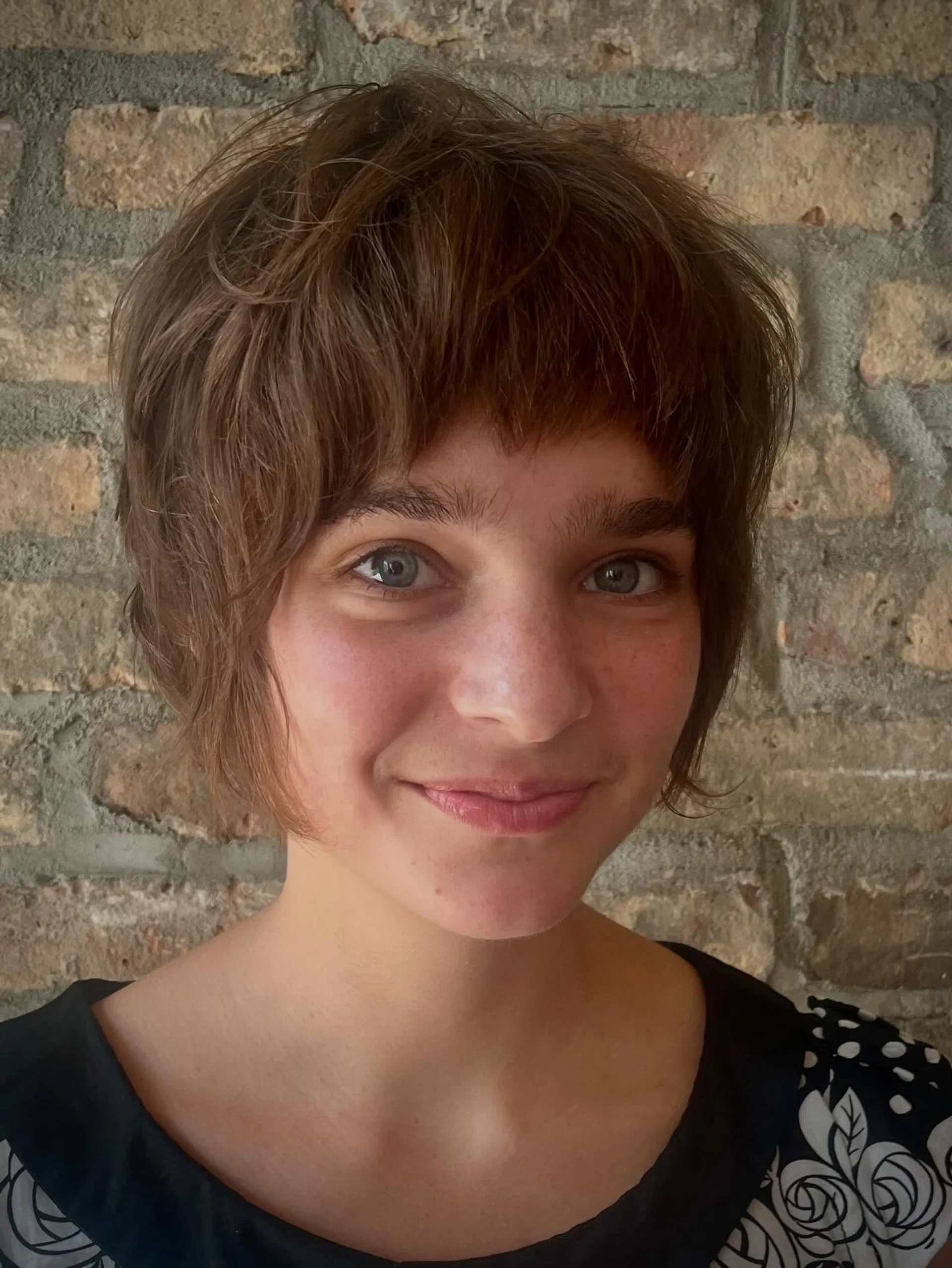 A model with a modern shaggy pixie cut, known as the Shixie, featuring textured layers and a chic, effortless finish, seen at a top NYC salon. - Preview 3