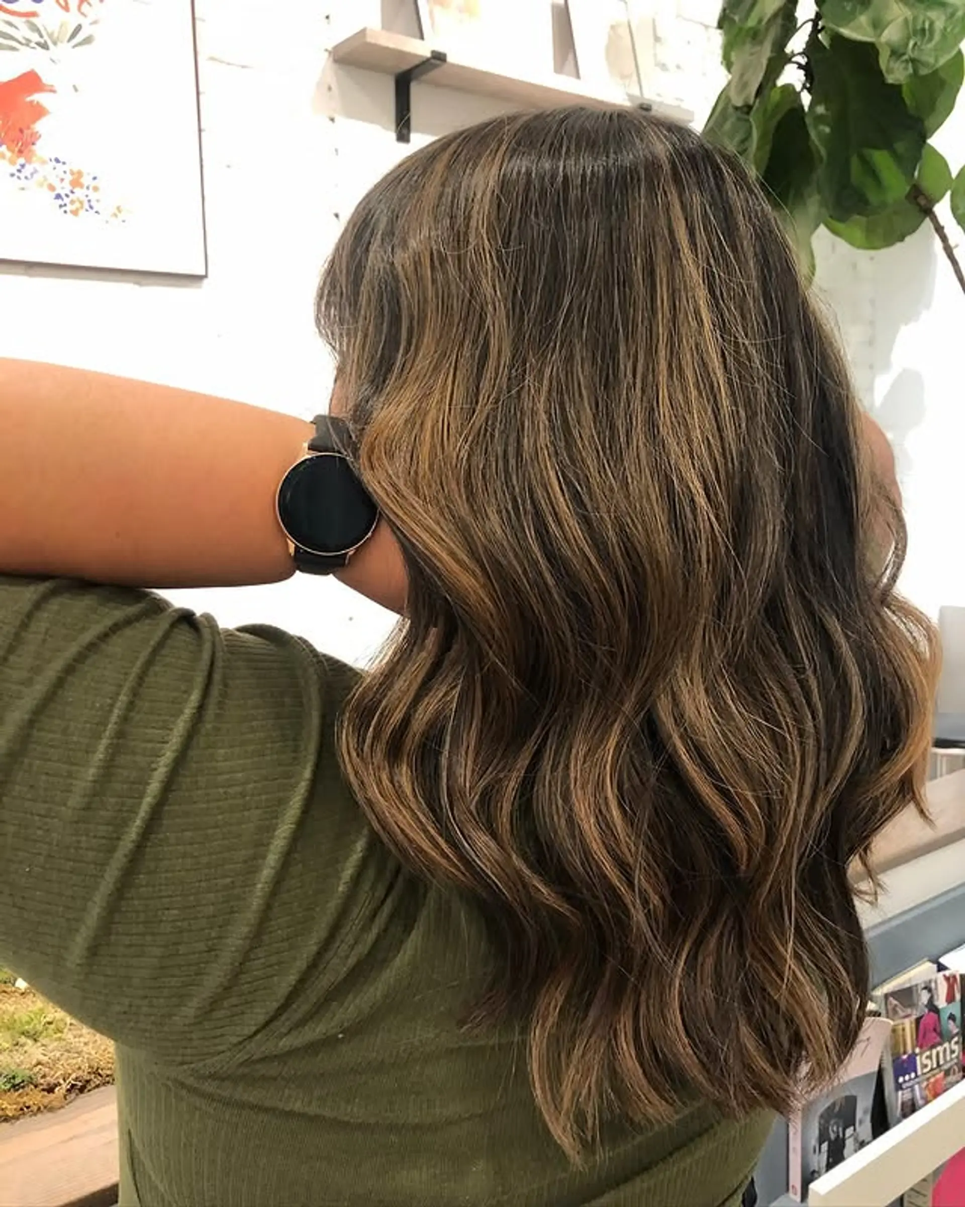 Medium length wavy hair with caramel highlights. 1