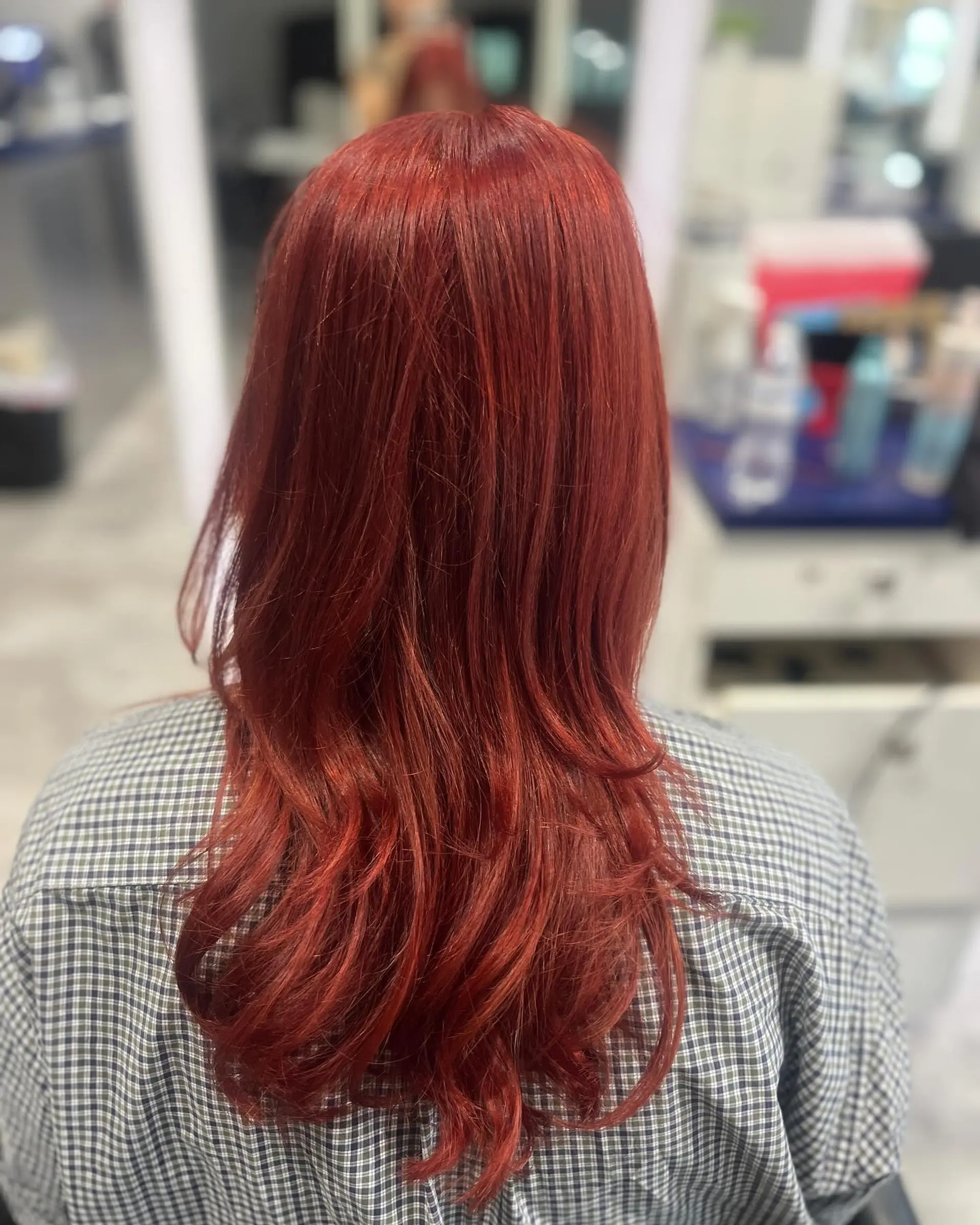 A layered long haircut with vibrant color. 1