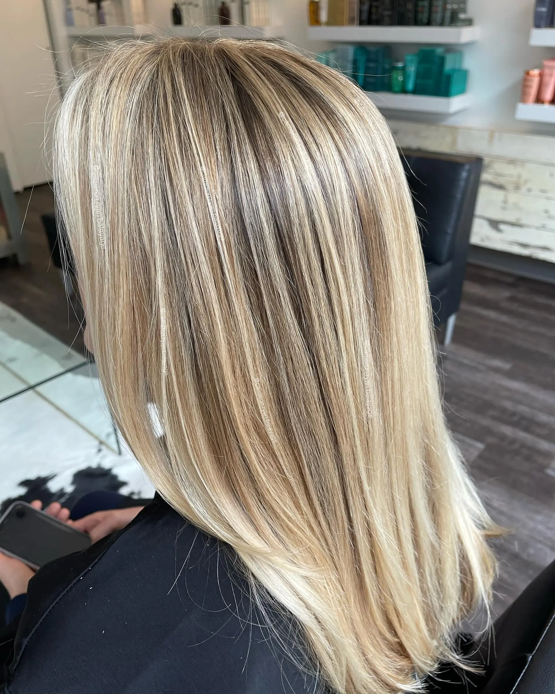 Straight, glossy long hair featuring bright blonde face-framing highlights woven seamlessly into a multi-tonal dimensional blonde base. 1