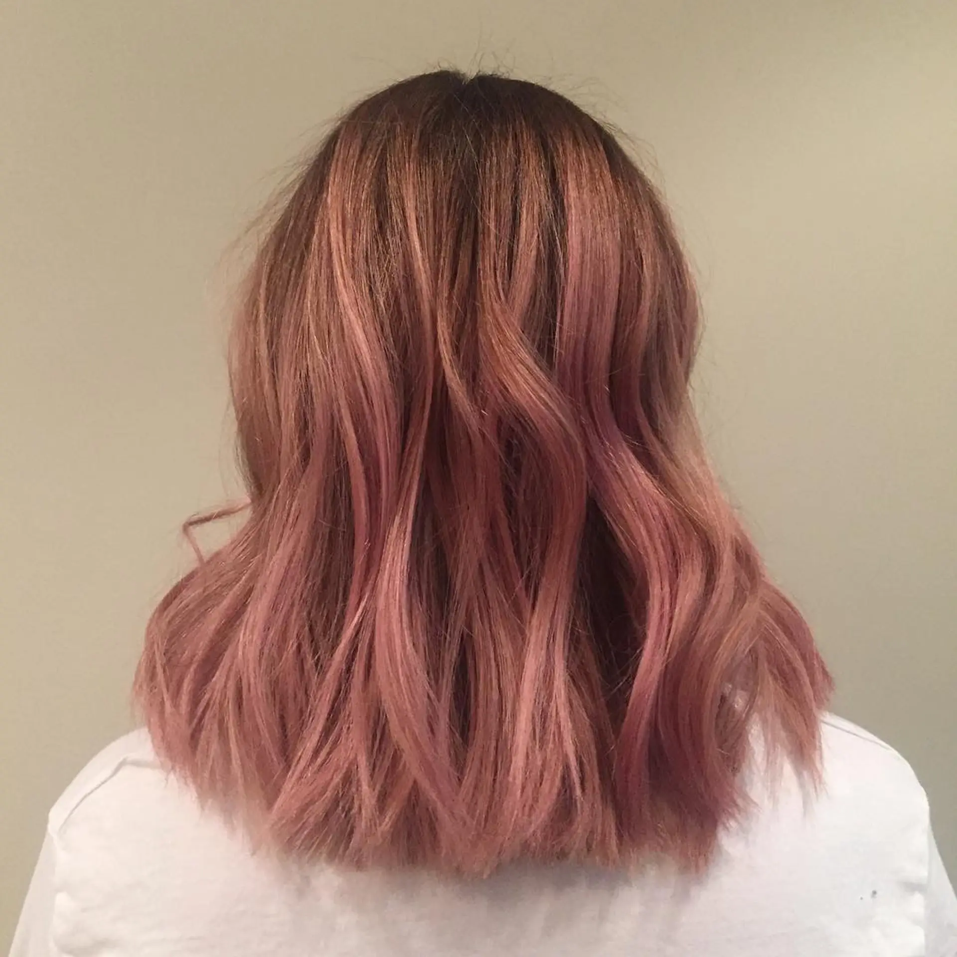 Wavy, medium-length lob with a rose gold balayage. 1