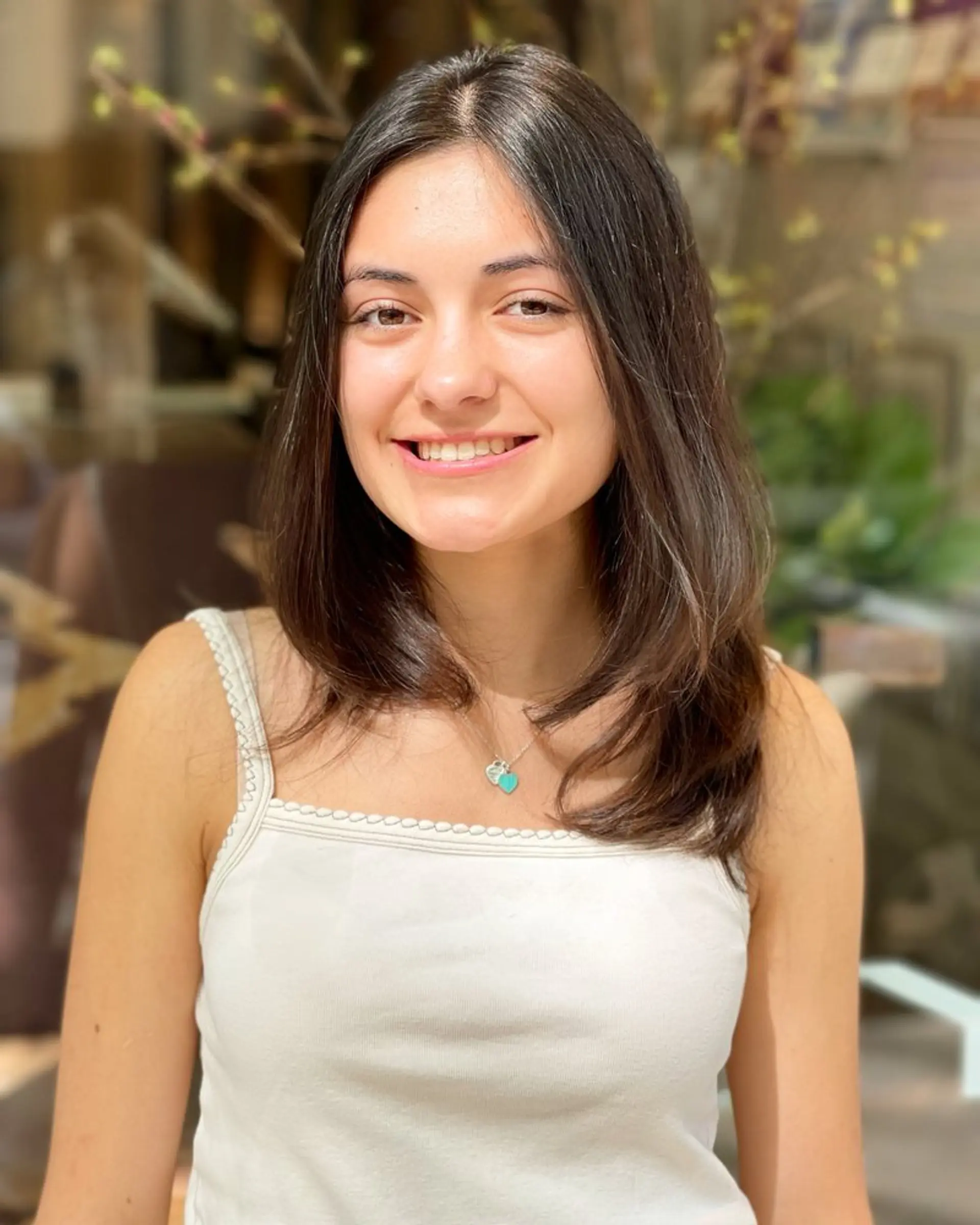 A timeless medium-length haircut with soft layers that frame the face, perfect for straight hair. 1