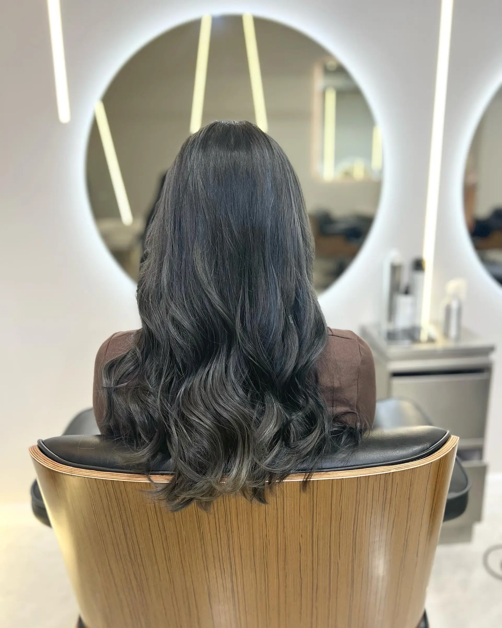 Long, wavy hair with a smoked ash color. 1