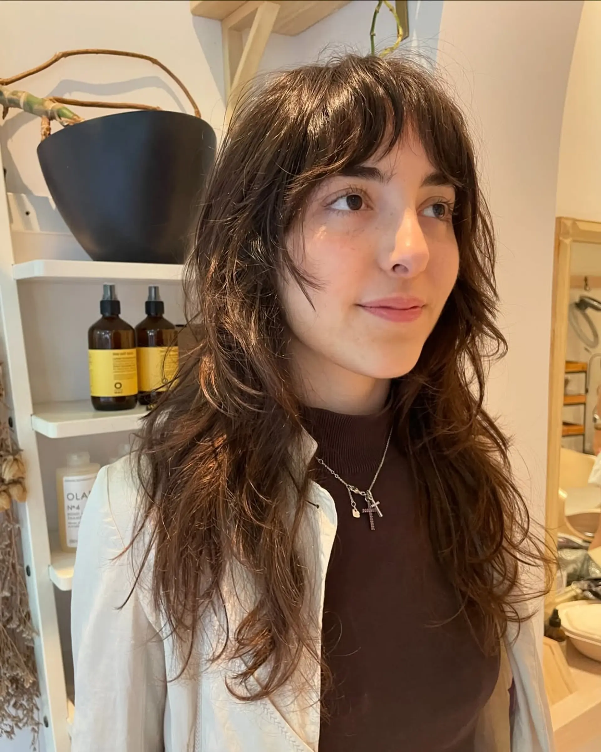A modern shag with choppy layers and trendy curtain bangs. 3