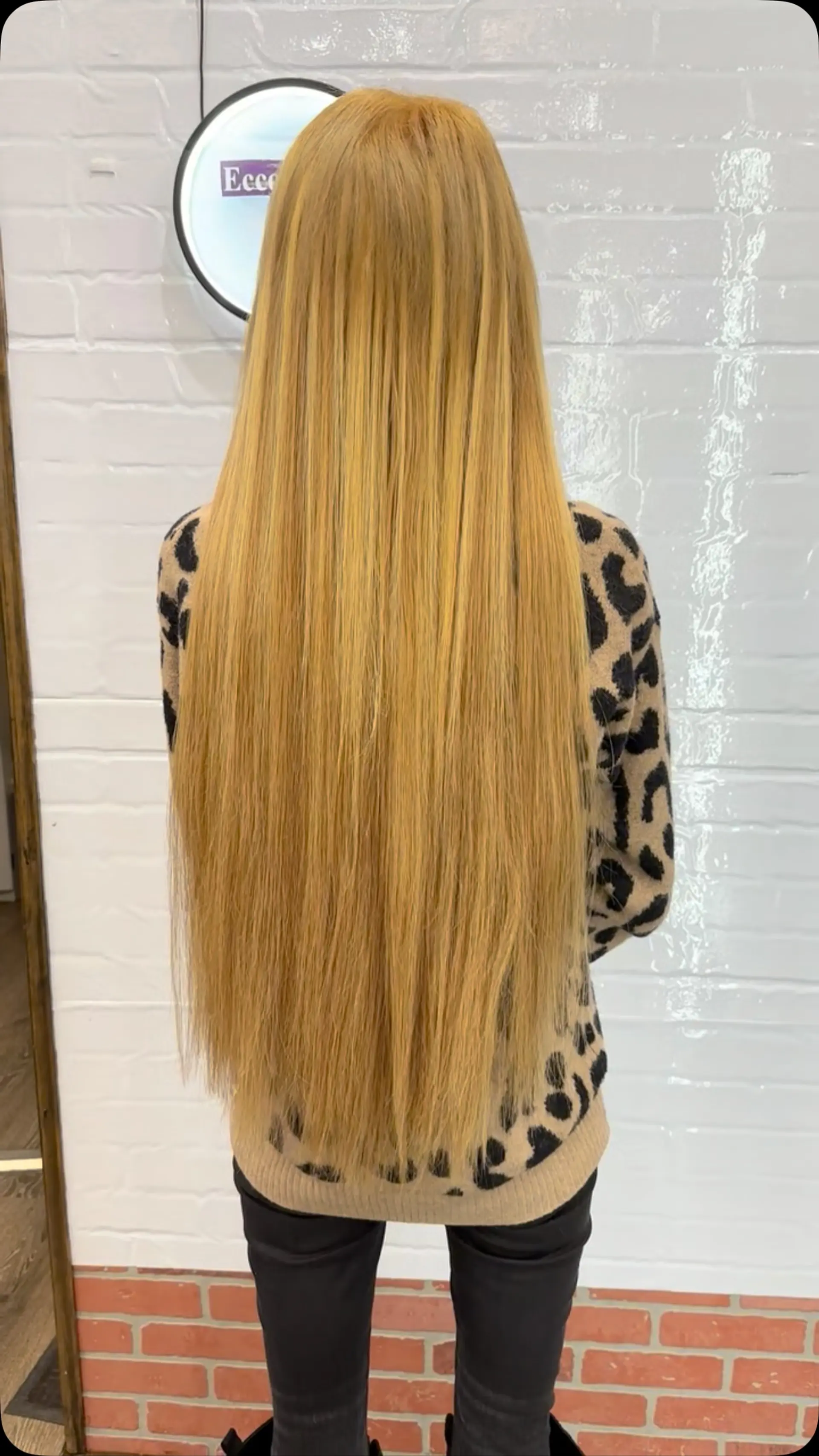 Extra long straight honey blonde hair falling smoothly down the back. 1