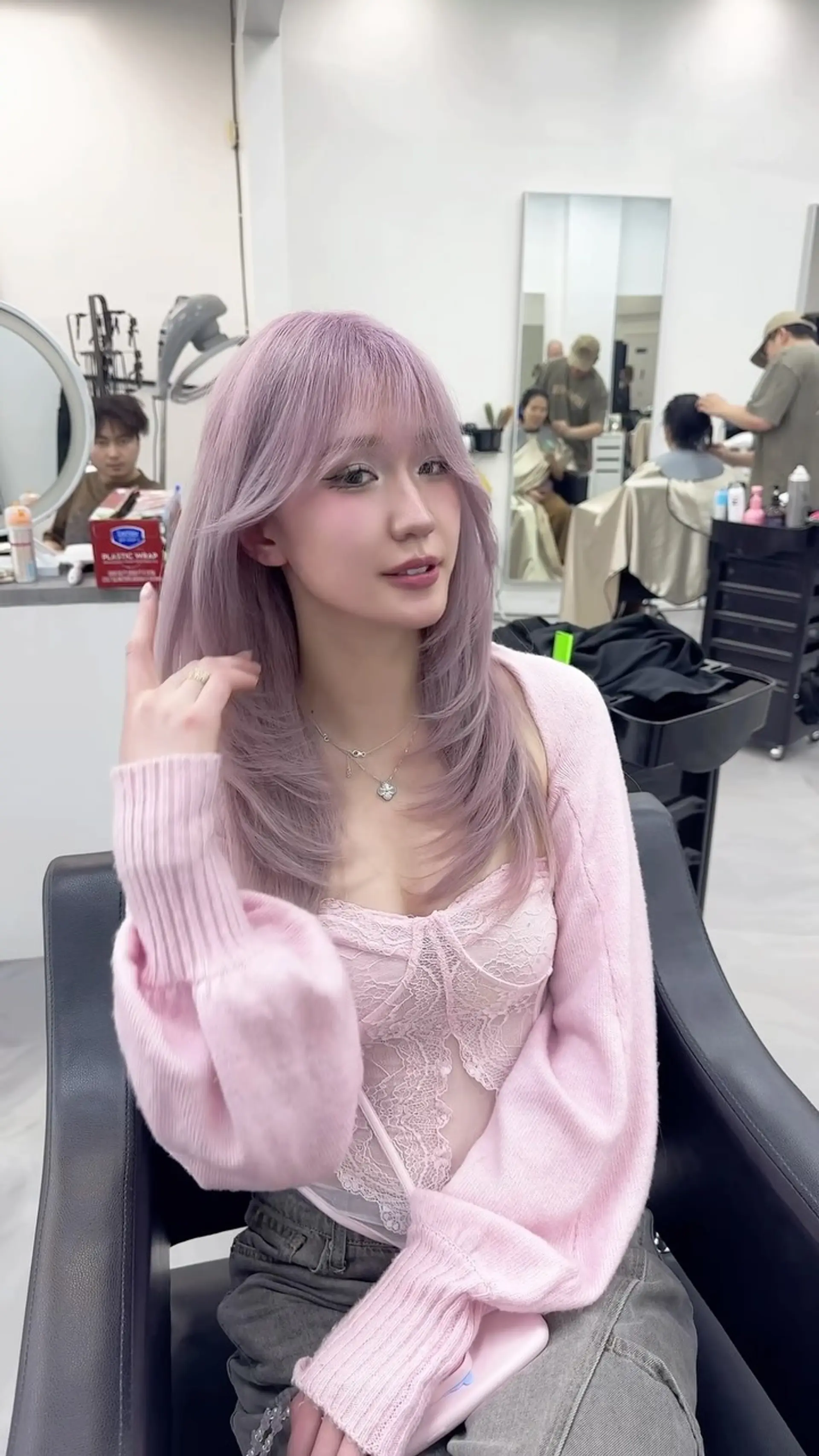A straight, soft pastel pink hairstyle featuring wispy bangs and curved, face-framing layered ends. 1