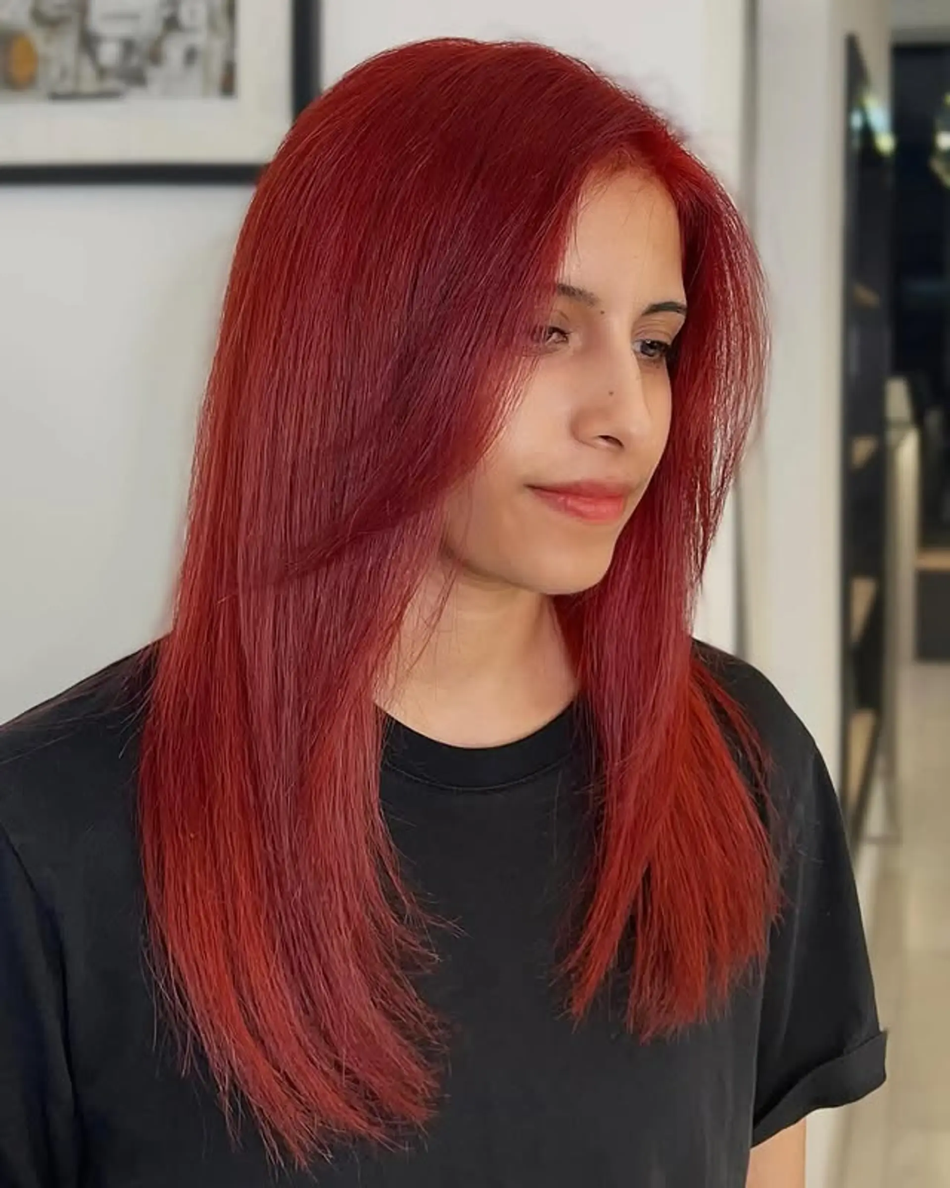 A layered, long hairstyle with face-framing layers. 1