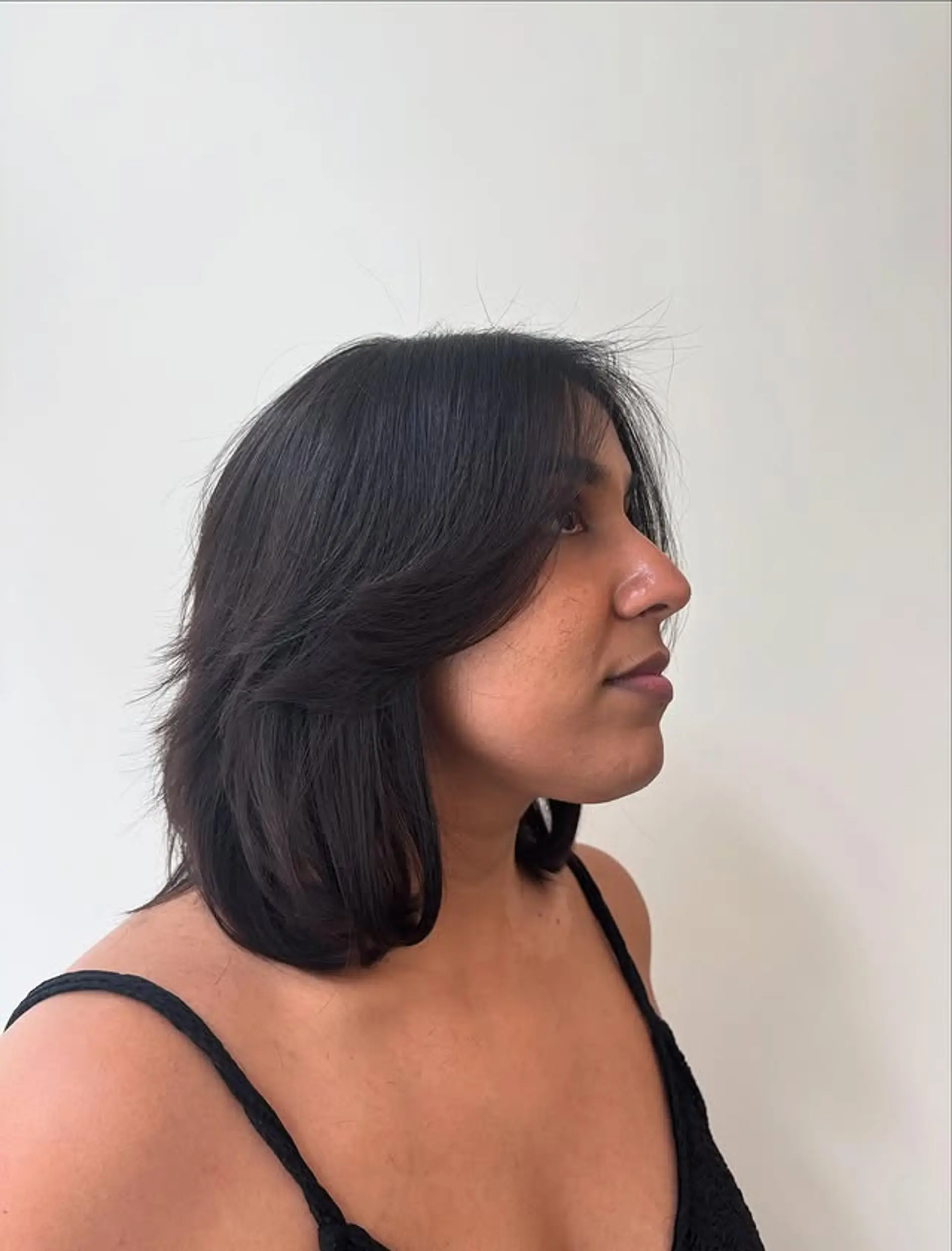 A layered shag haircut with curtain bangs. 1