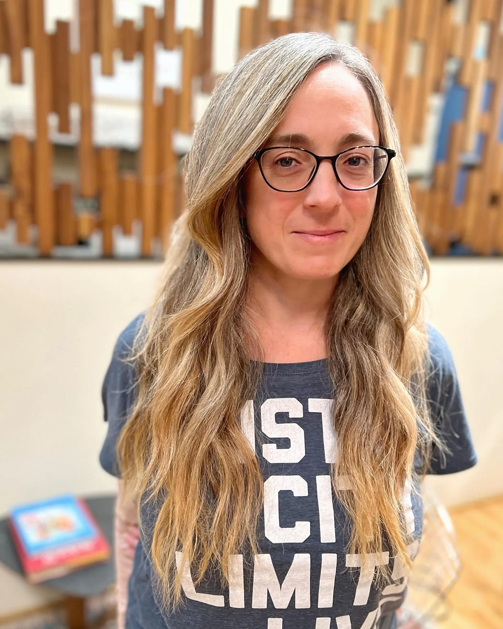 Long, wavy hair with a beautiful ash blonde balayage that creates a soft, natural look. 1