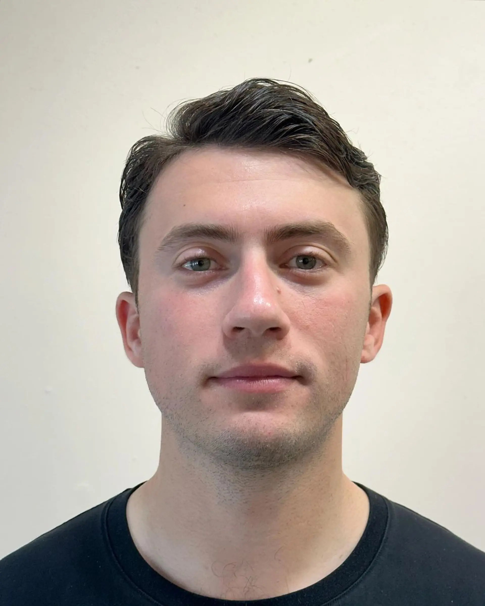 Sleek and polished side-swept style with a smooth finish and tapered sides. 3