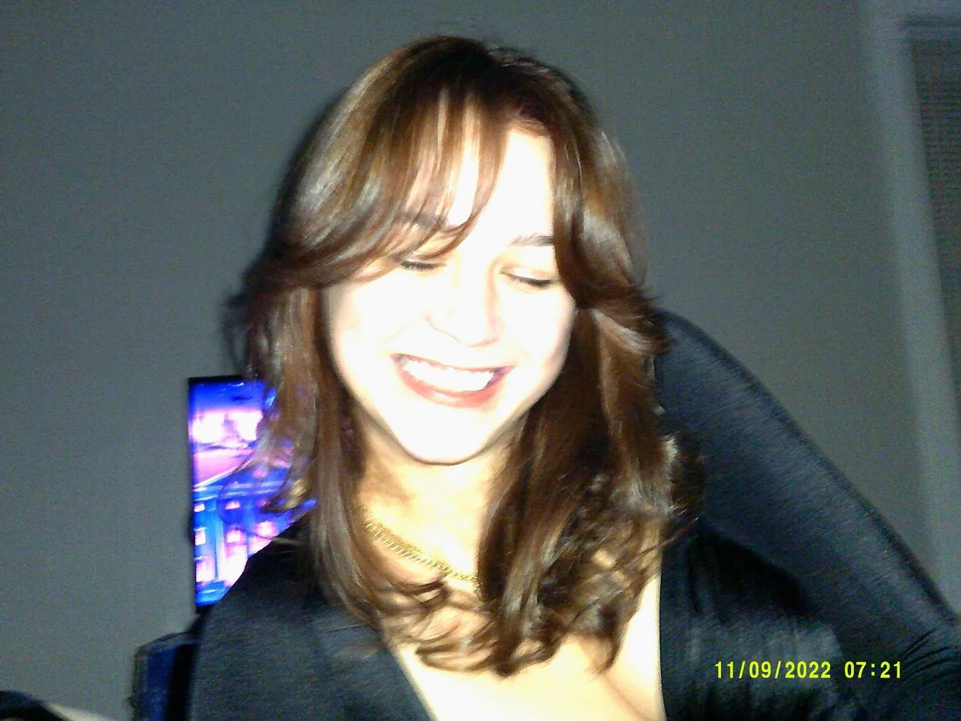 Model featuring modern long layers with face-framing curtain bangs - Preview 1