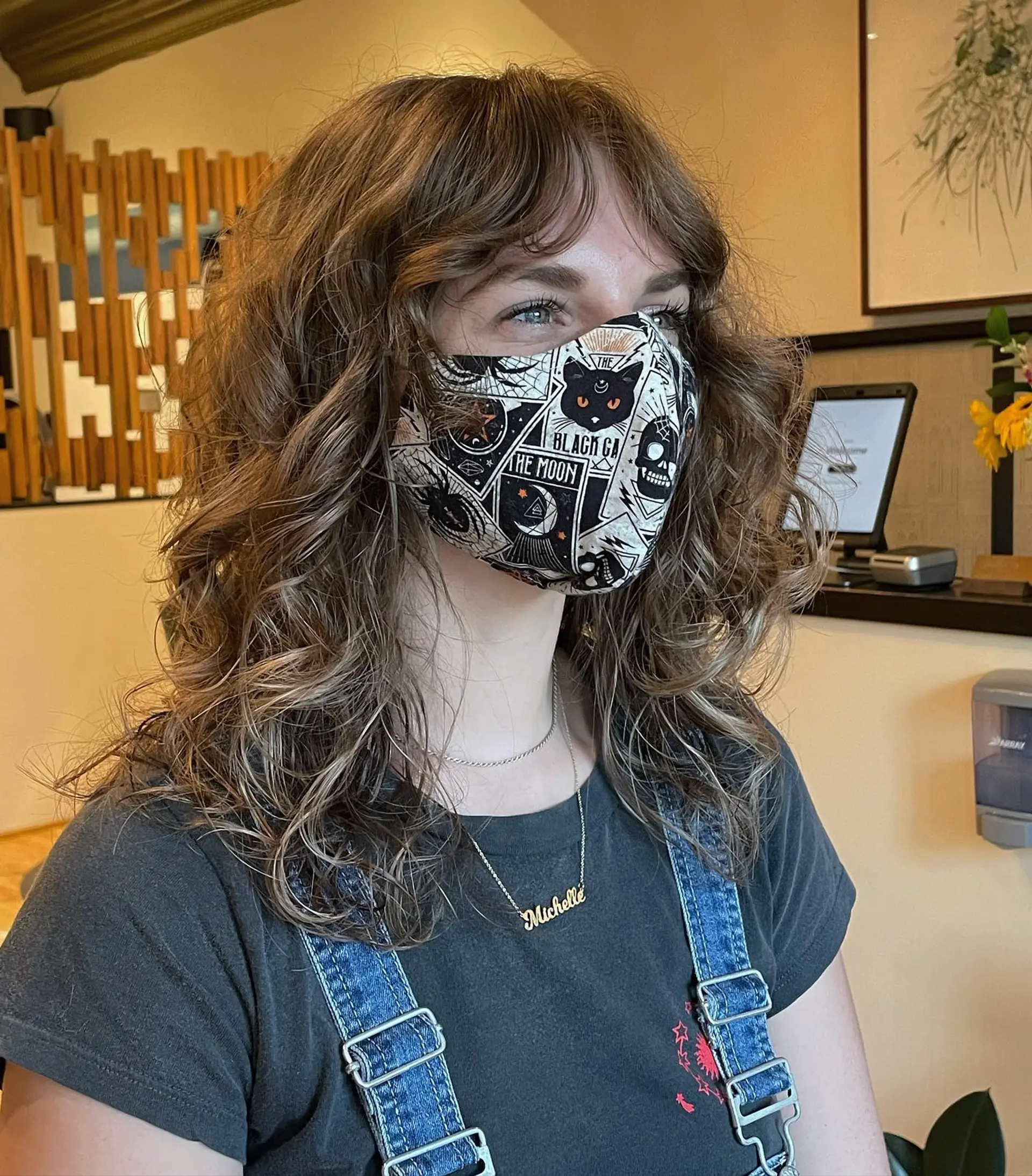 A shaggy, layered cut with curtain bangs, styled into loose waves. 1