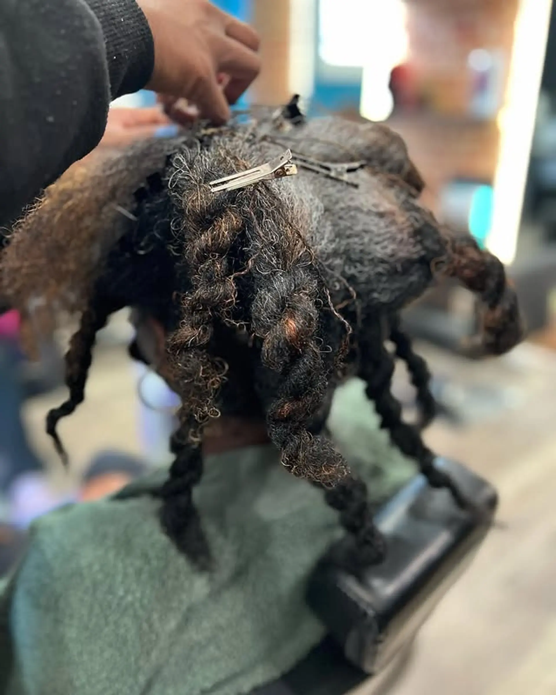 Sisterlocks with a focus on the maintenance and retightening process. 1