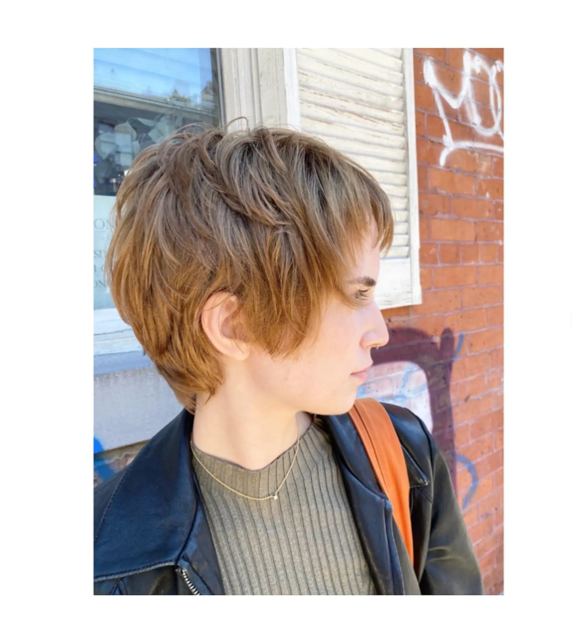 A short, textured pixie cut with layered bangs. 1