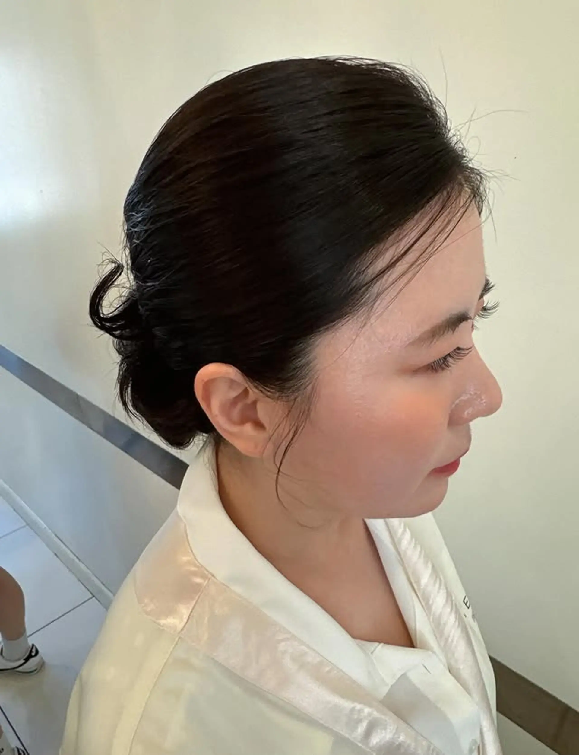 A sleek and elegant low bun updo, perfect for formal occasions. 1