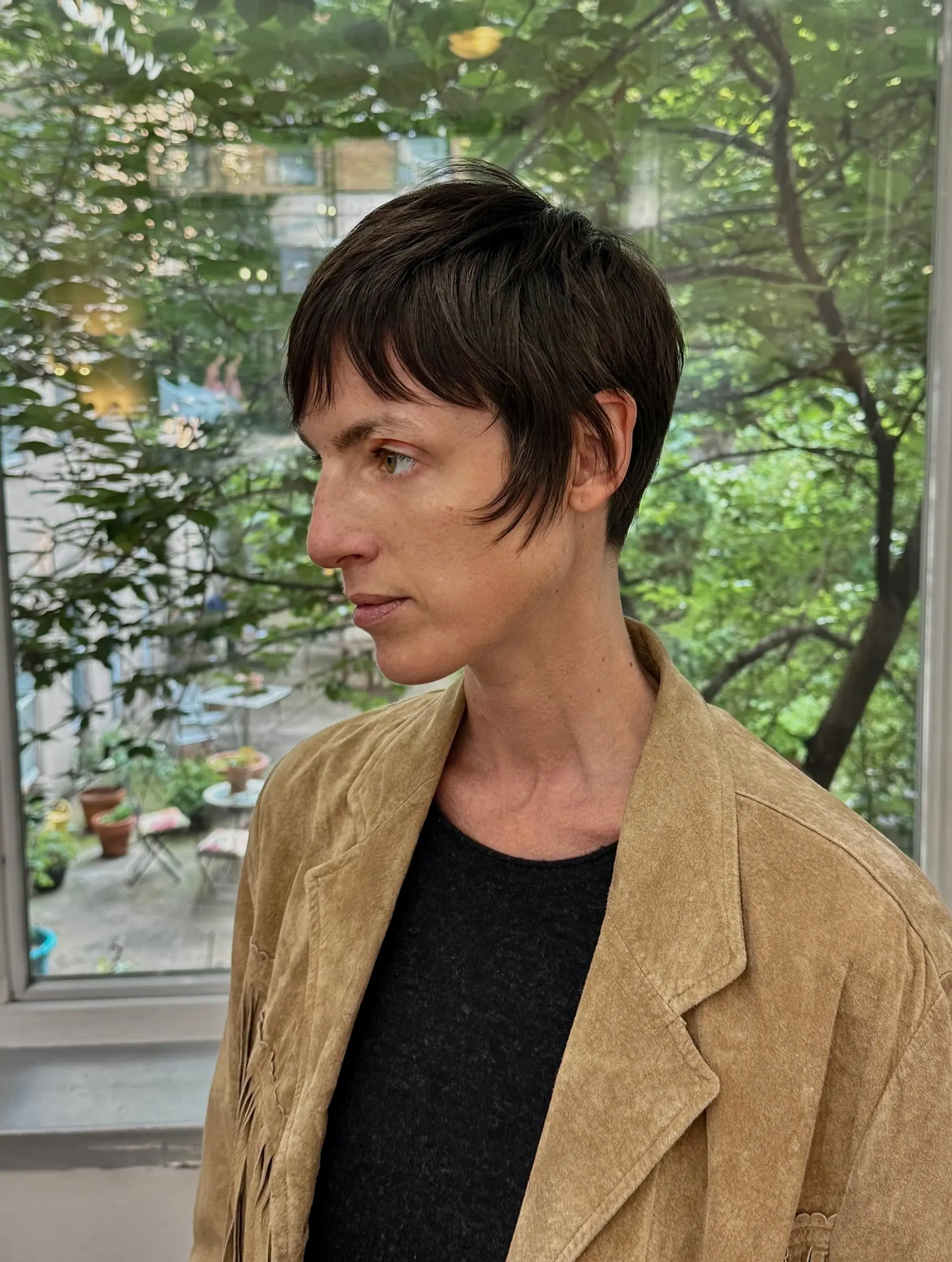 A short pixie cut with textured bangs. 1