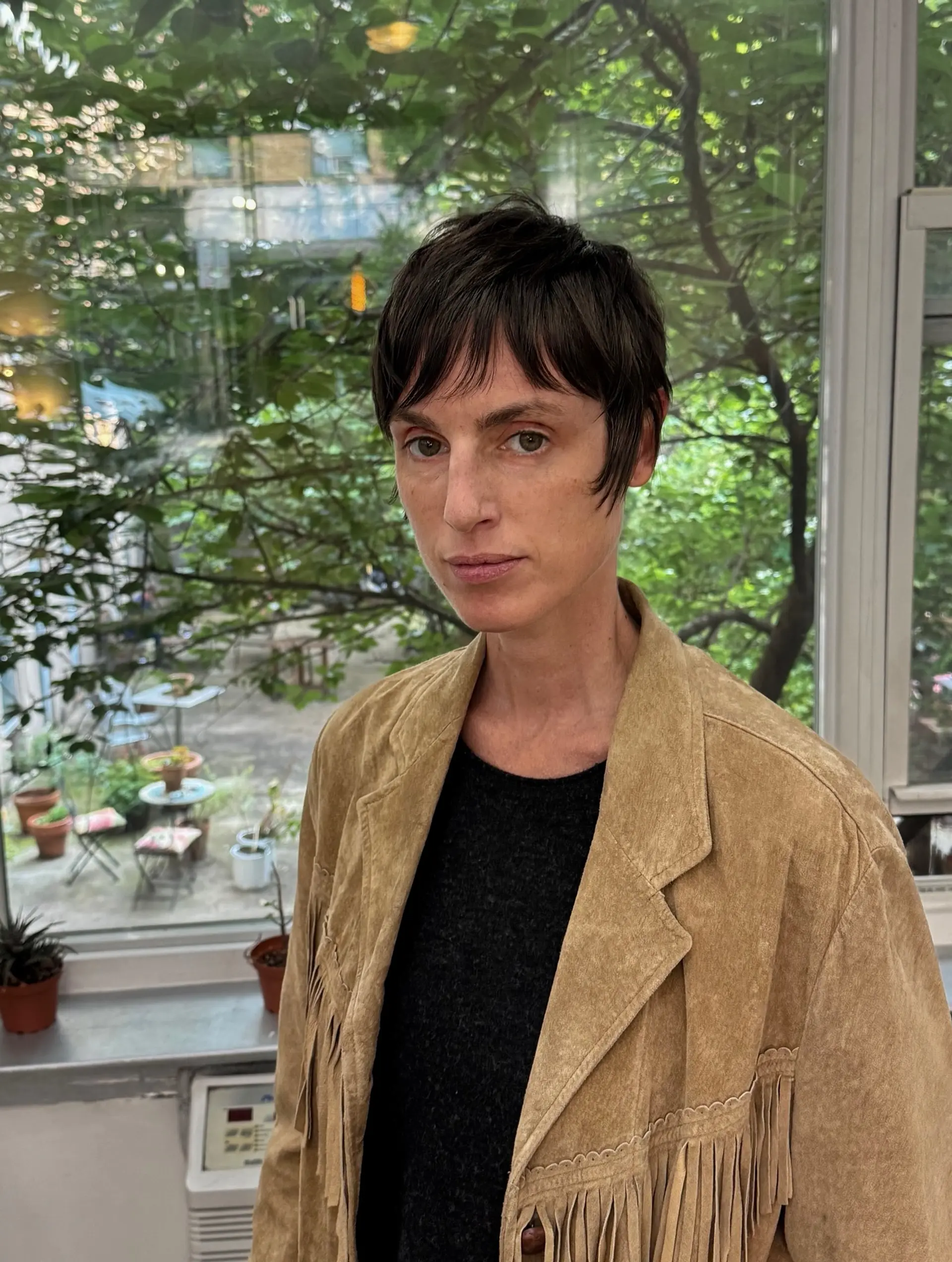 A short pixie cut with textured bangs. 2