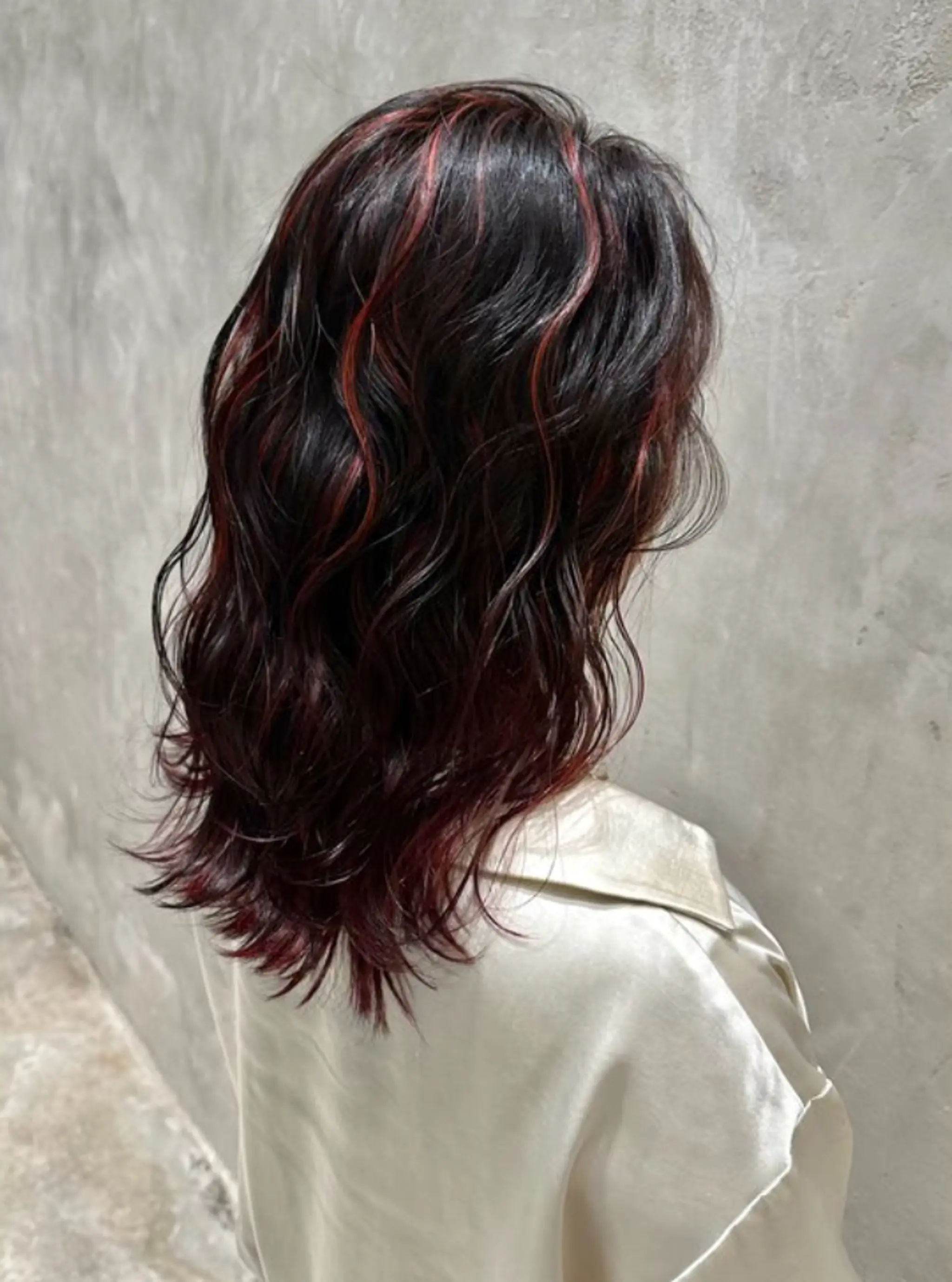 Rich black wavy locks with crimson red highlights, cascading to medium length with soft, defined waves.
(NonstopStyle: by Hiro) 2